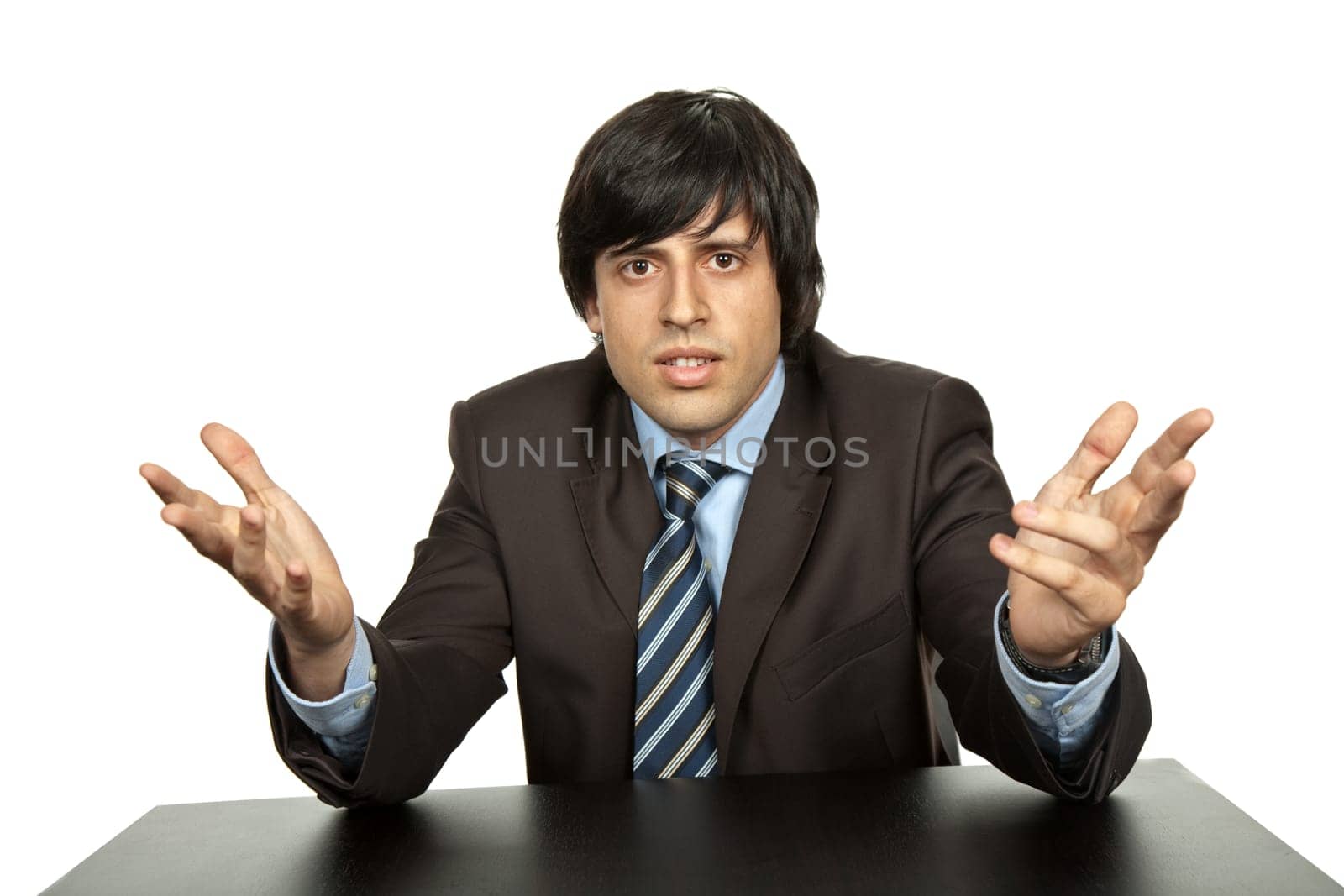 young business man on a desk, isolated on white