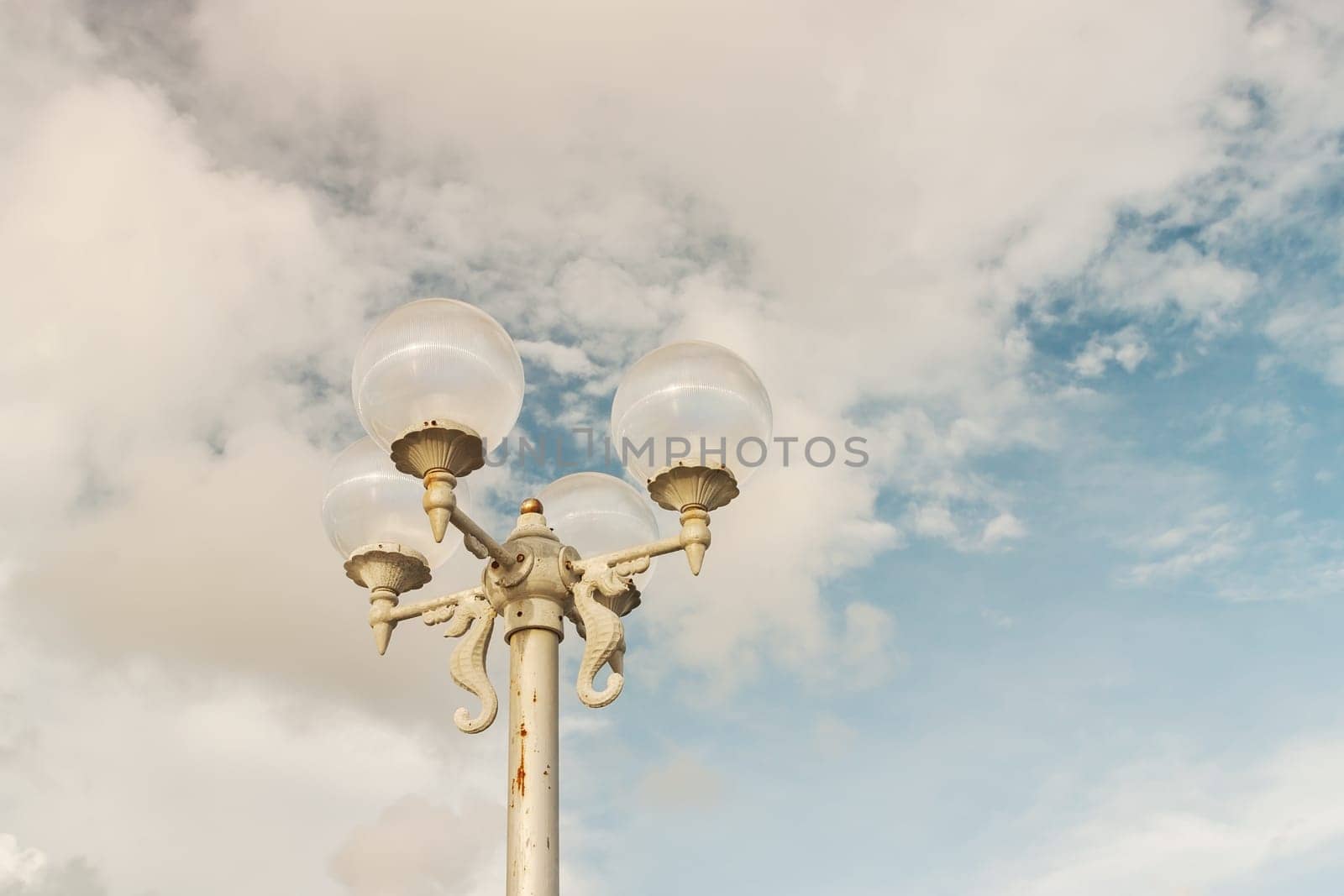 Light bulb with sky and cloud background