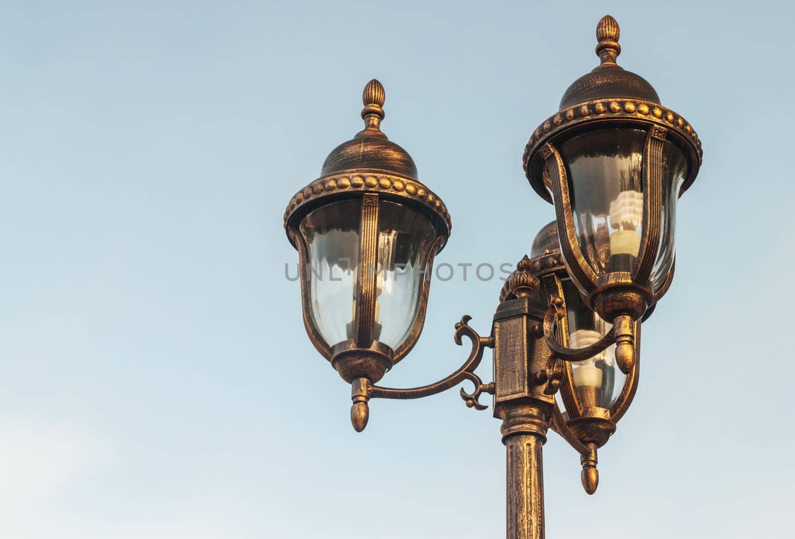 Light bulb with blue sky and cloud background