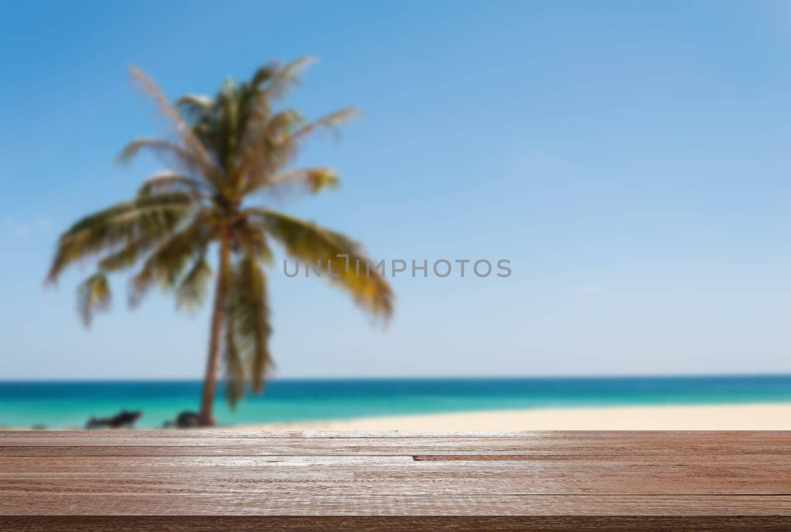 Wood table top on blurred blue sea and white sand beach - Can be used for display or montage your products