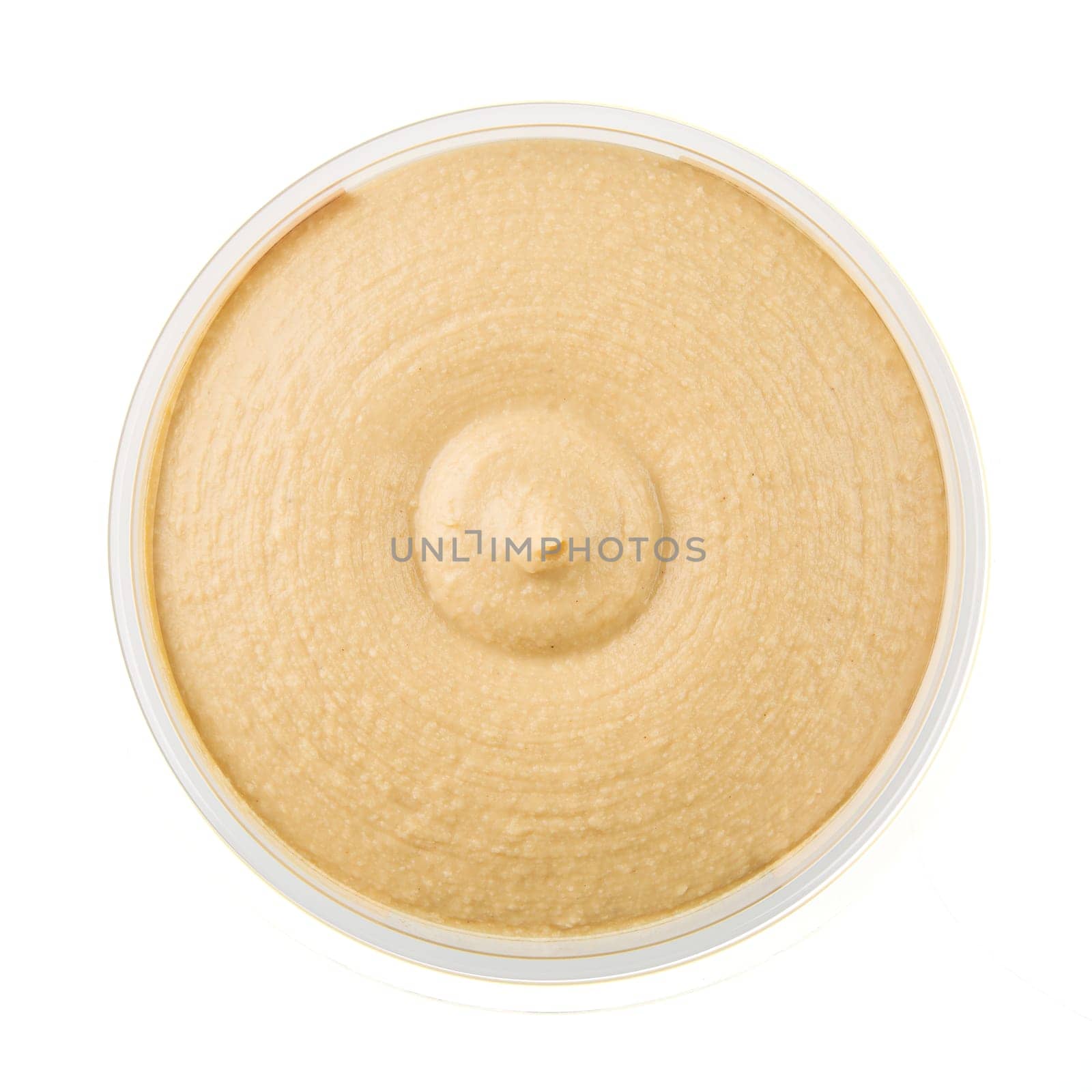 Healthy hummus in container from above and isolated on a white background.