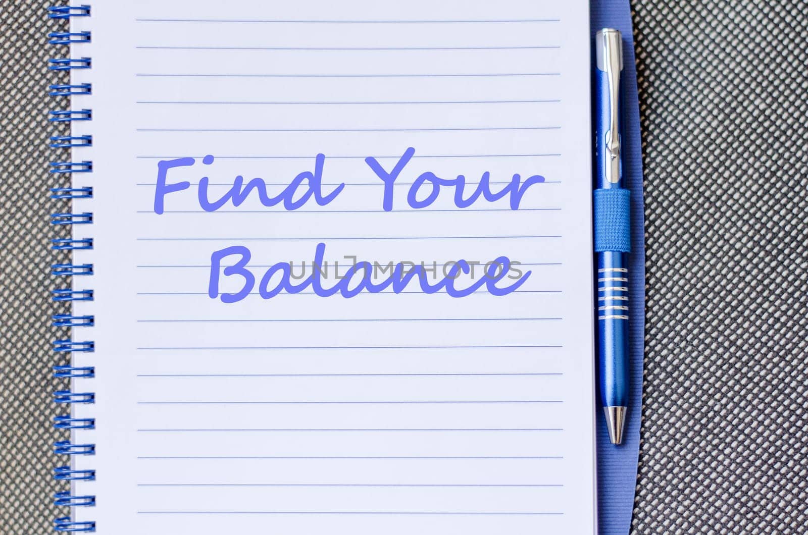 Find your balance text concept write on notebook with pen