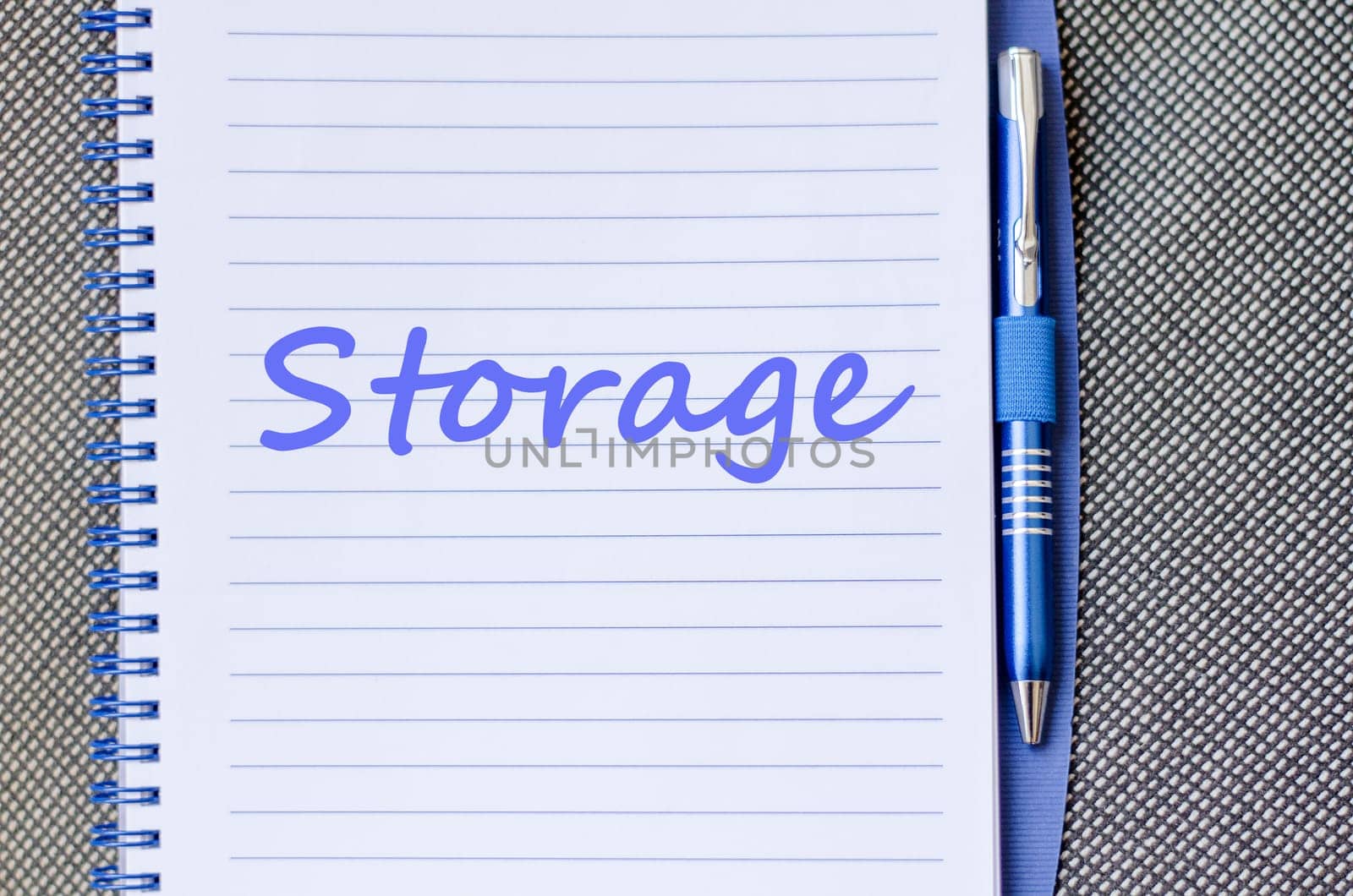 Storage text concept write on notebook with pen