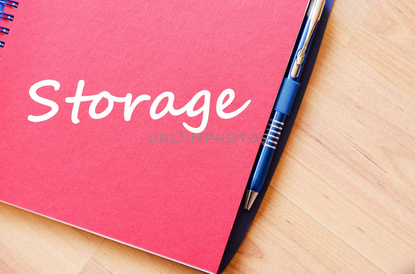 Storage text concept write on notebook with pen