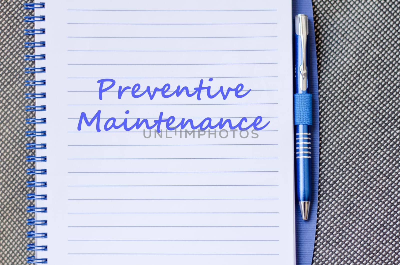 Preventive maintenance text concept write on notebook with pen