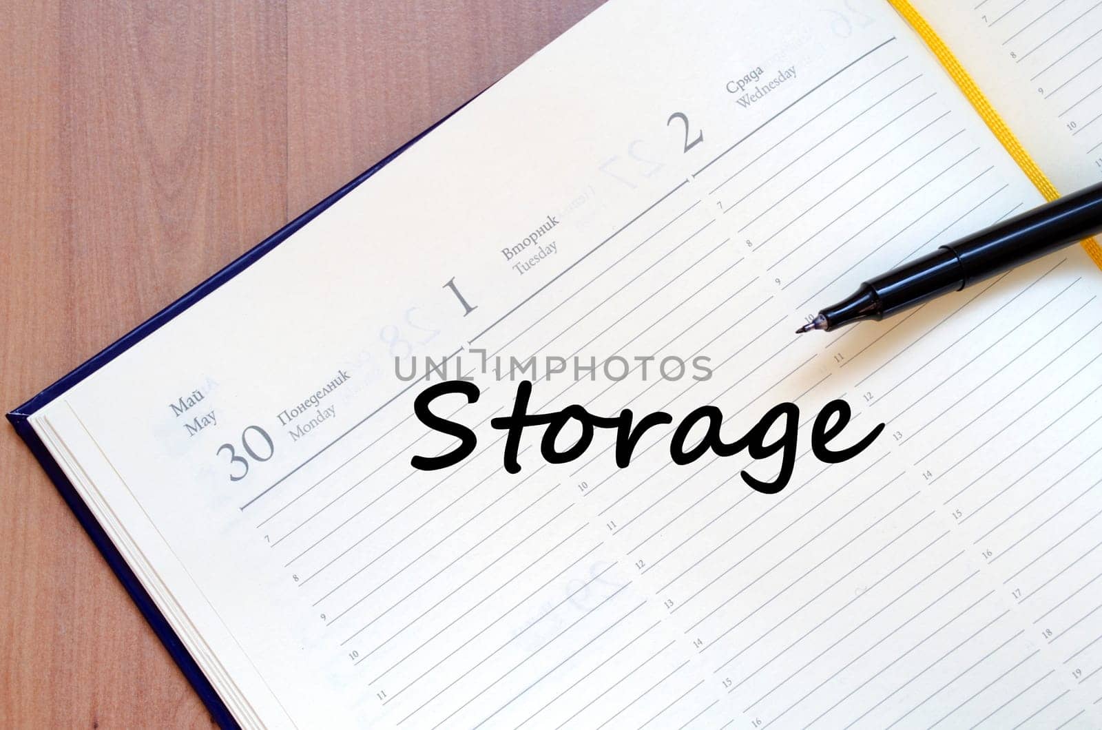 Storage text concept write on notebook with pen