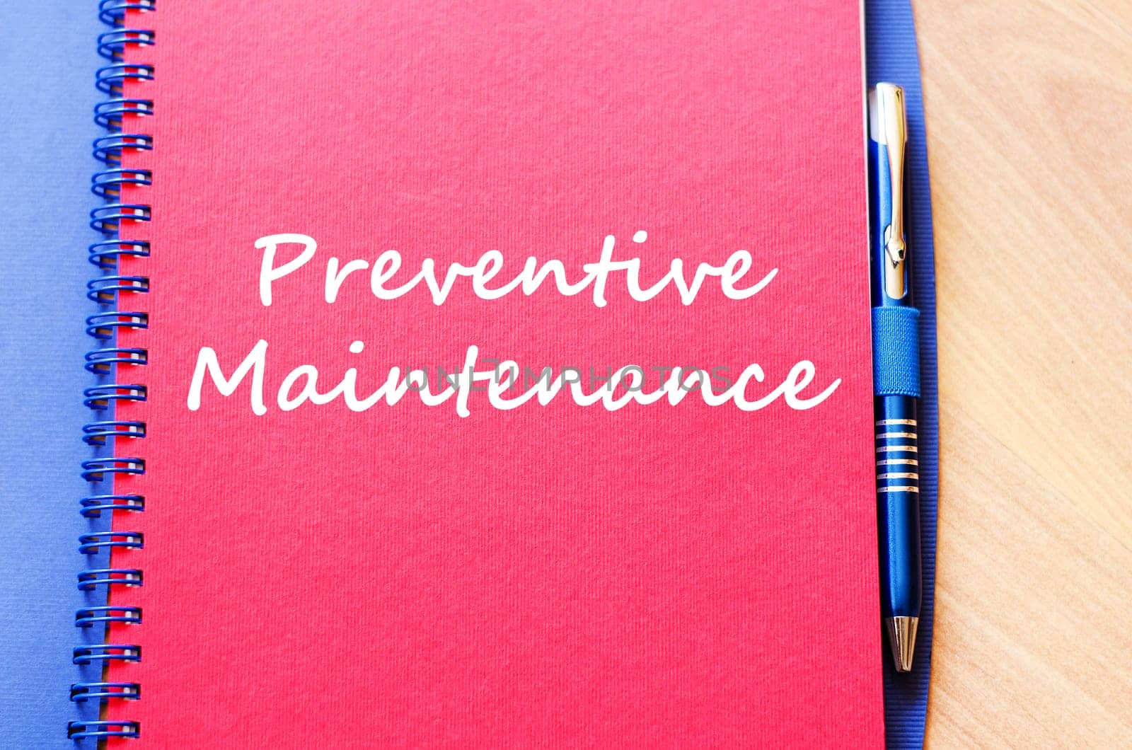 Preventive maintenance text concept write on notebook with pen