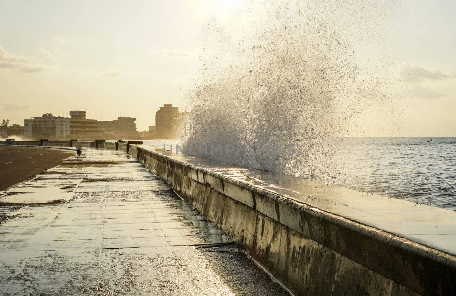water splashing over the pier in havana, Cuba