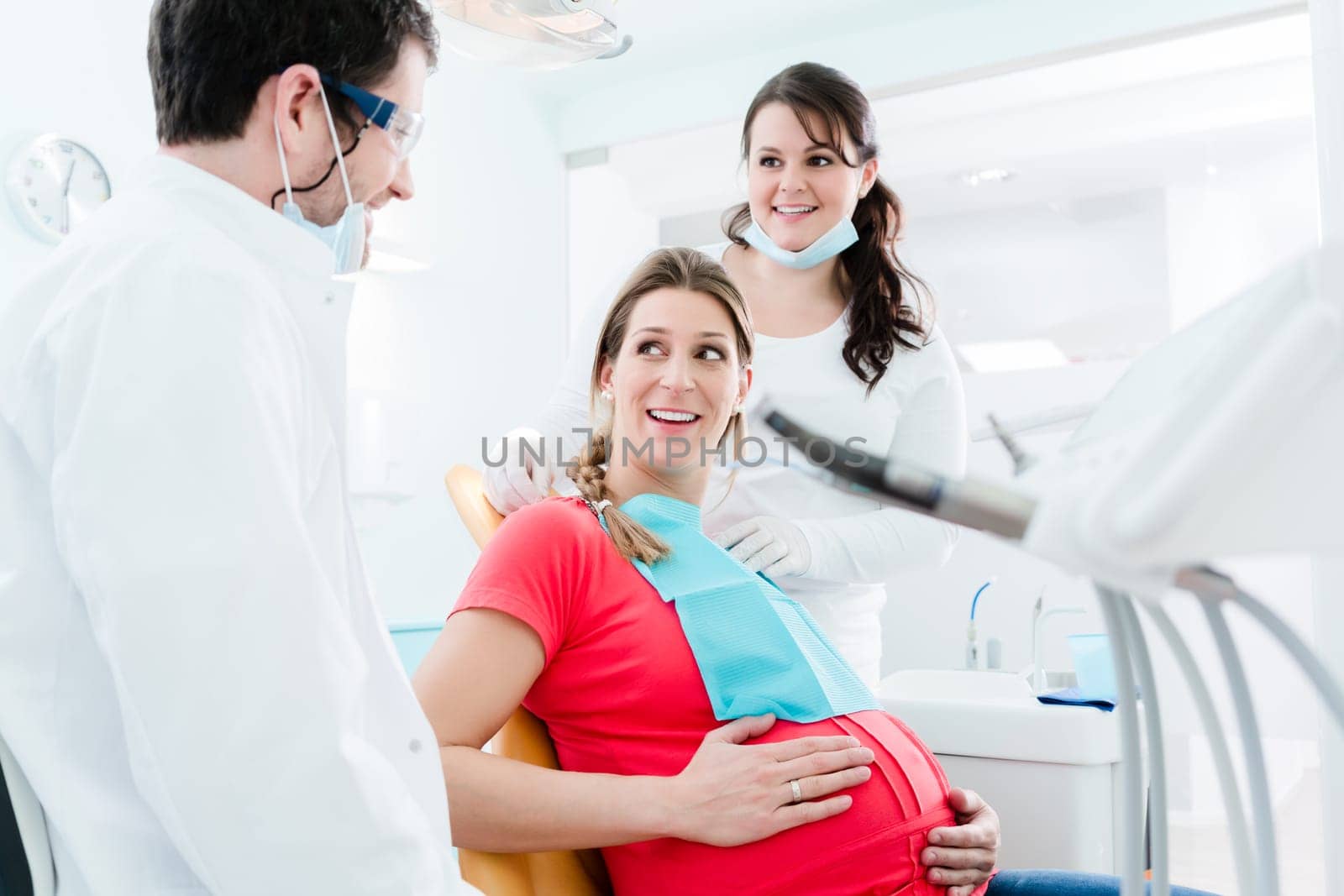 Pregnant woman at dentist before treatment