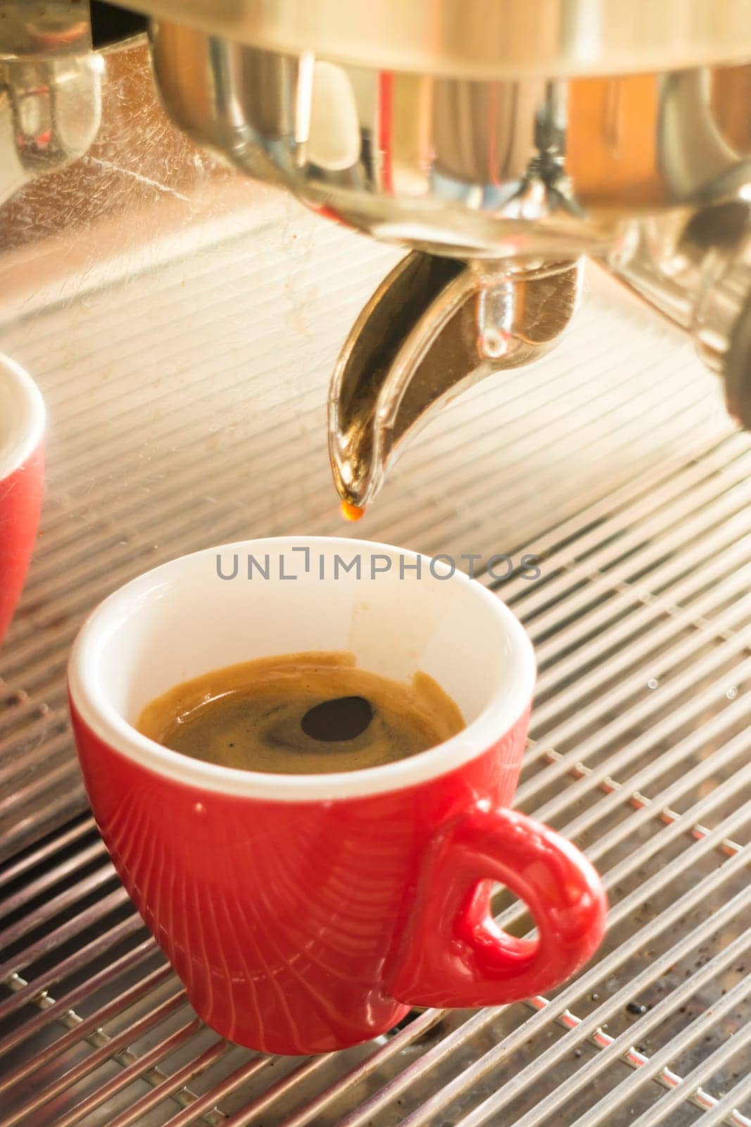 Fresh brew hot coffee from espresso machine with vintage filter effect, stock photo