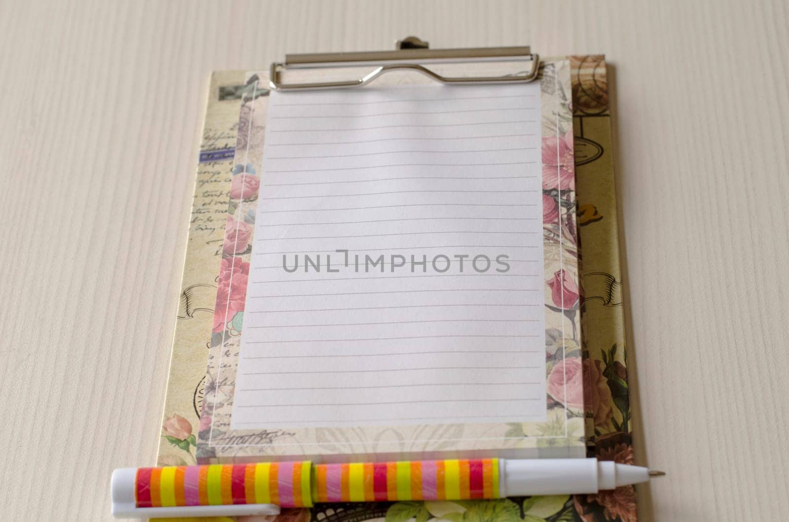 Notebook and pen on wood table and place for text