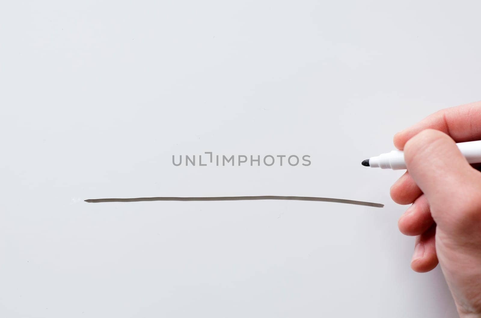 Human hand and whiteboard with place for text