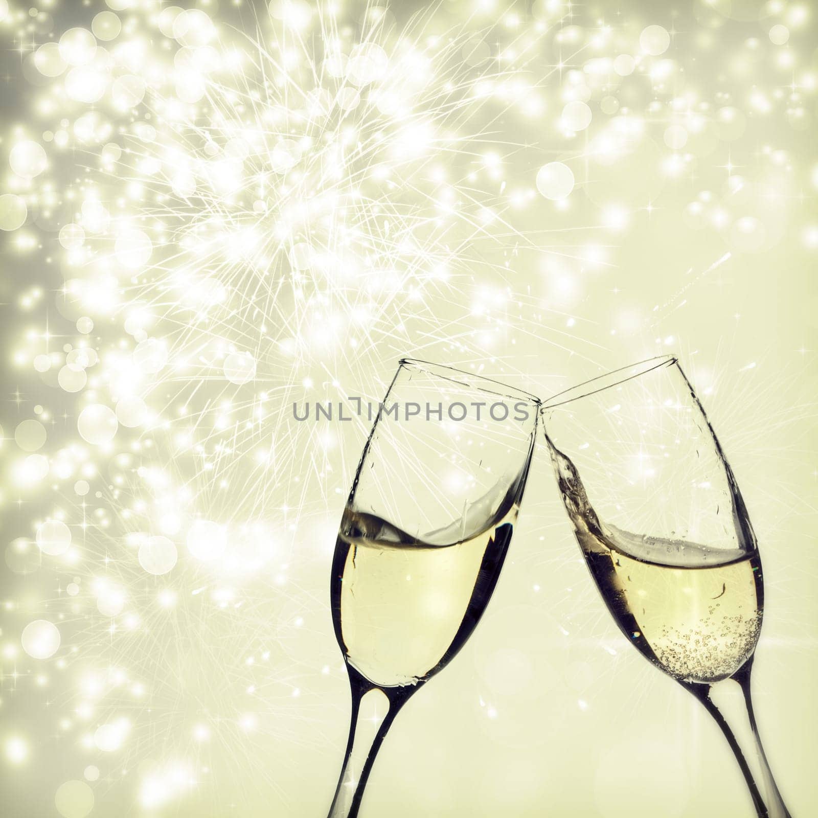 Champangne glasses on sparkling background