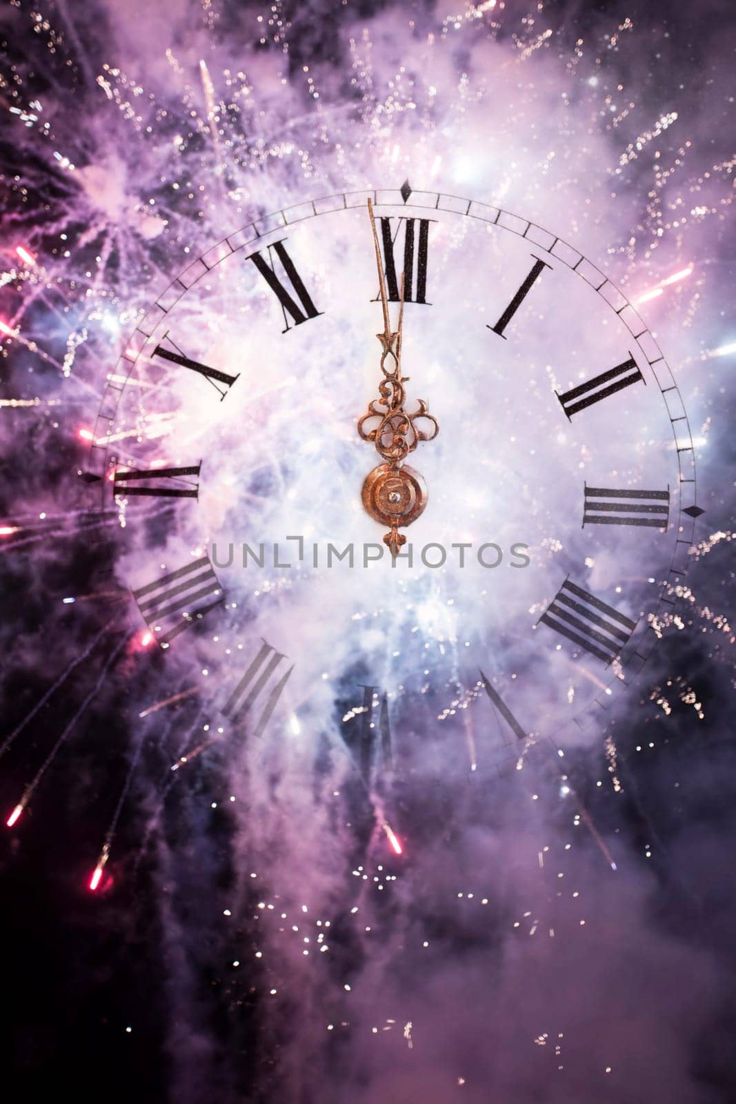 New Year's at midnight - Old clock with stars snowflakes and holiday lights