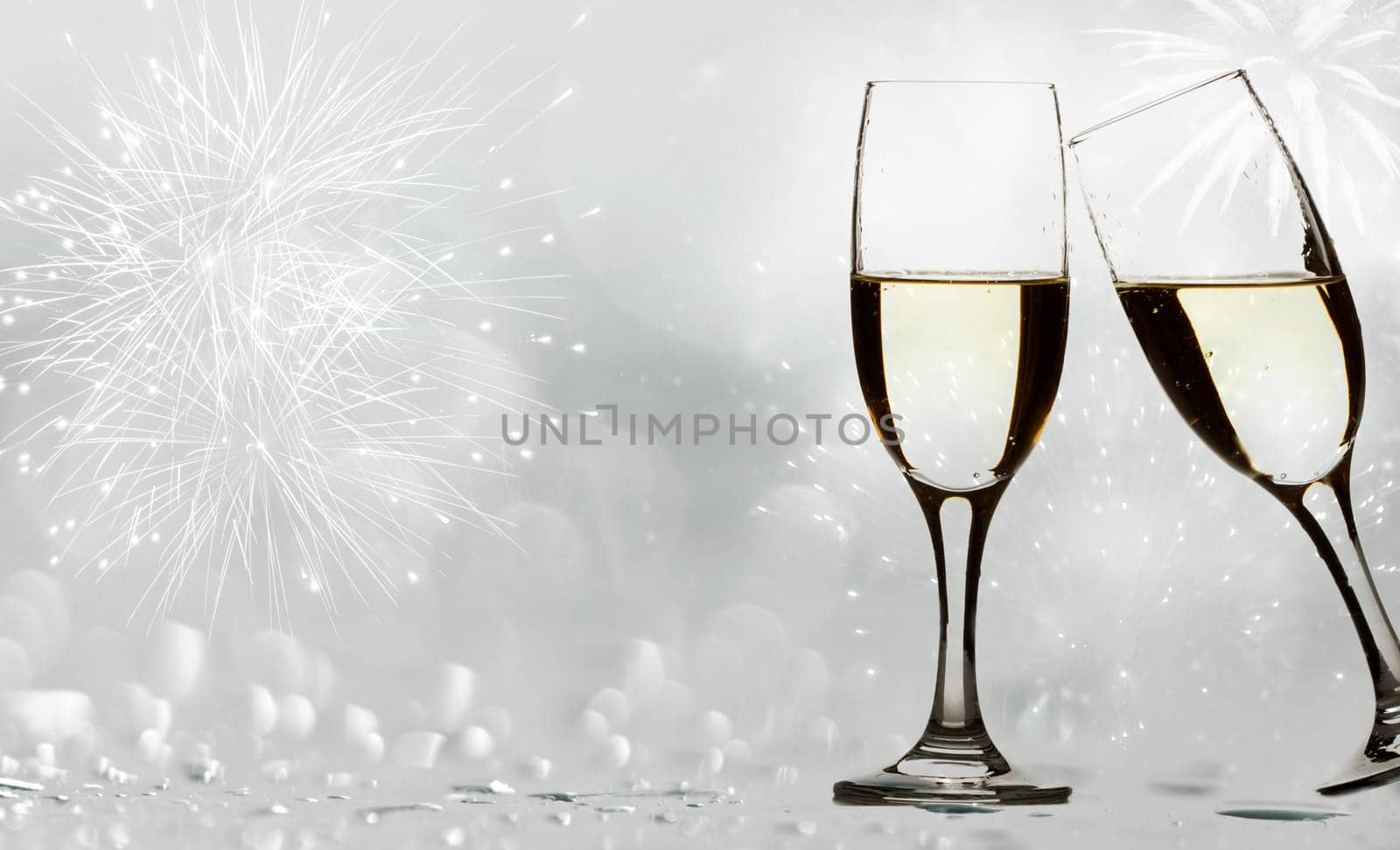 Champangne glasses on sparkling background