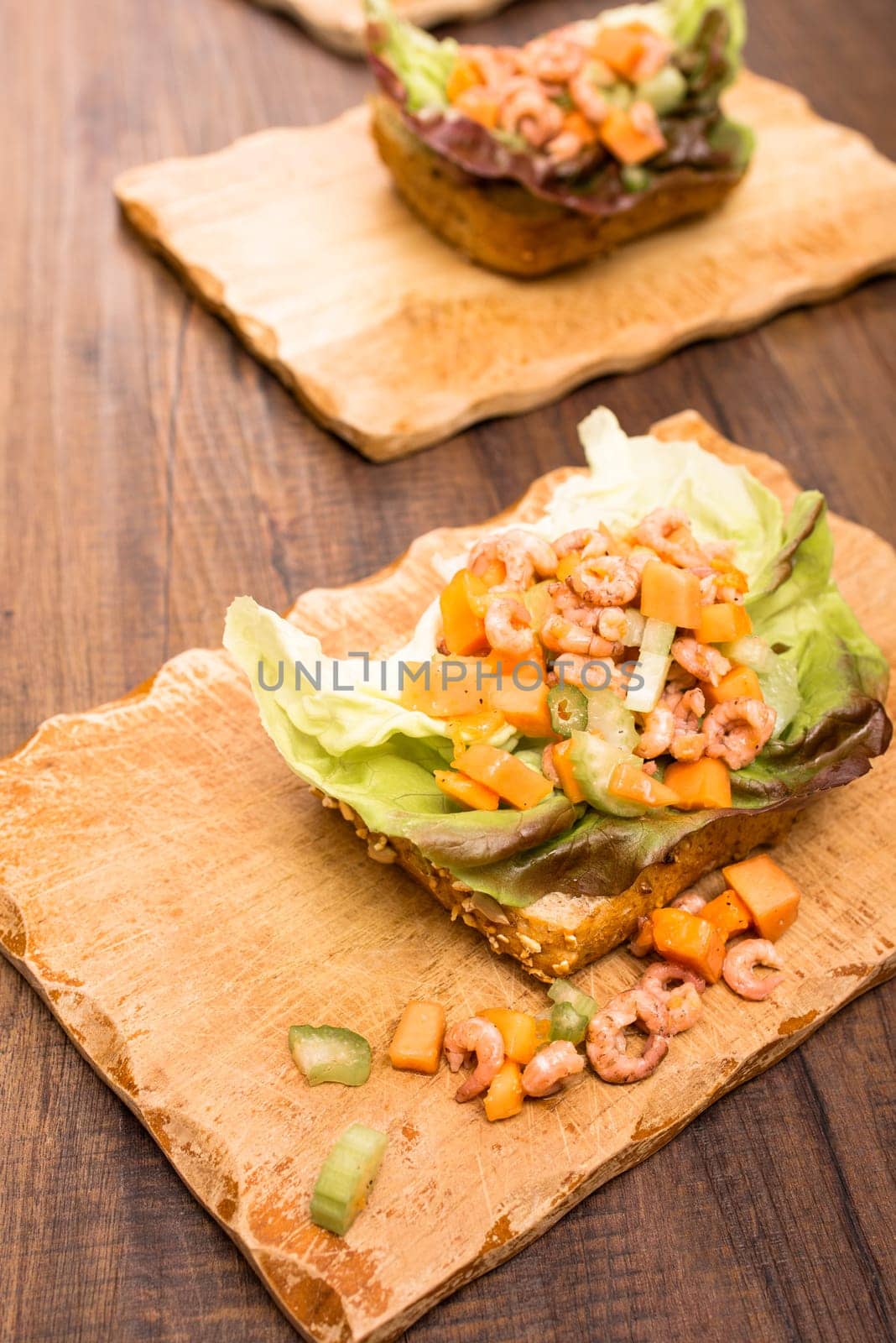 Bread rolls with crab and salad from celery and papaya