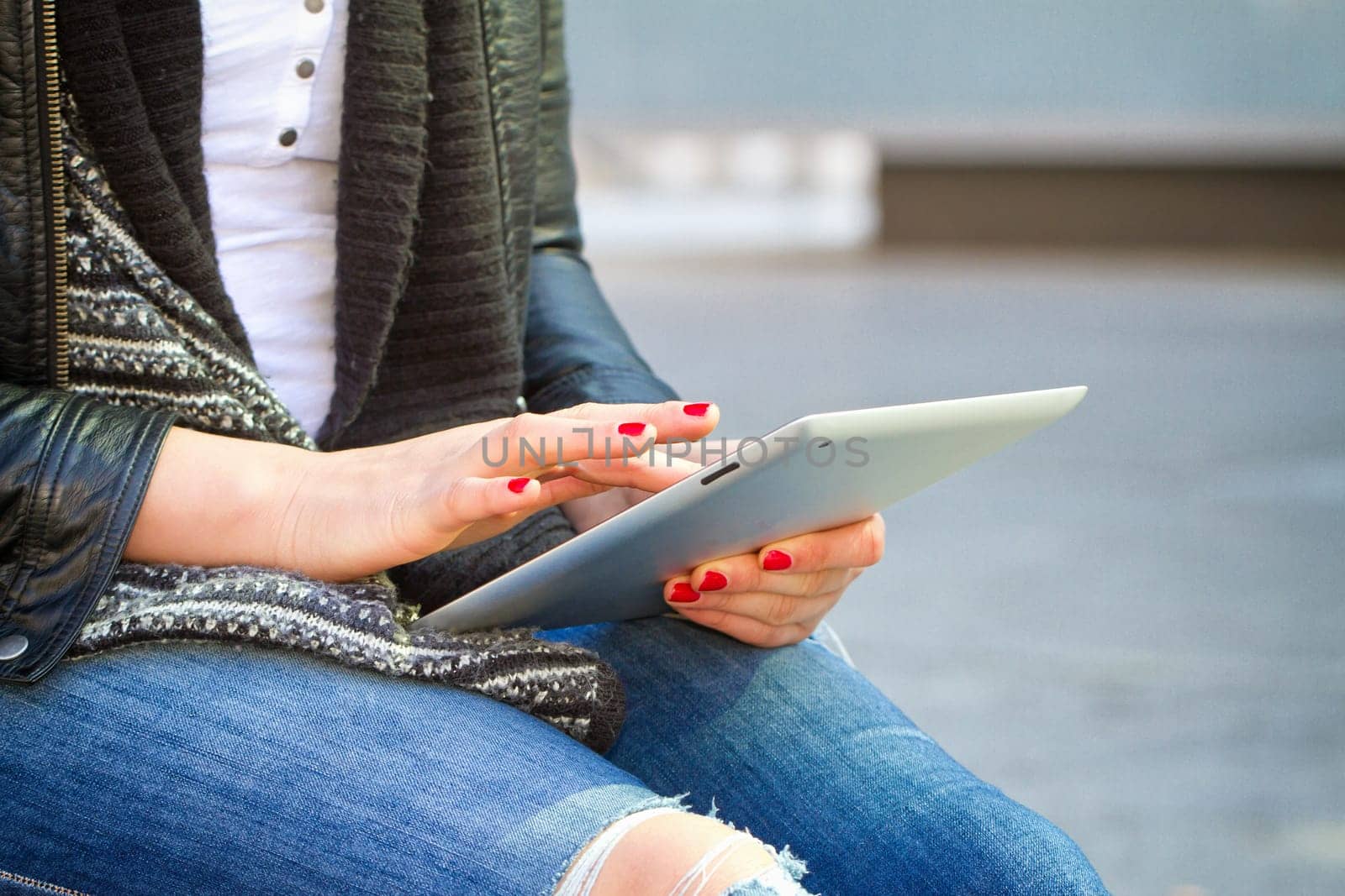 Young modern woman with tablet