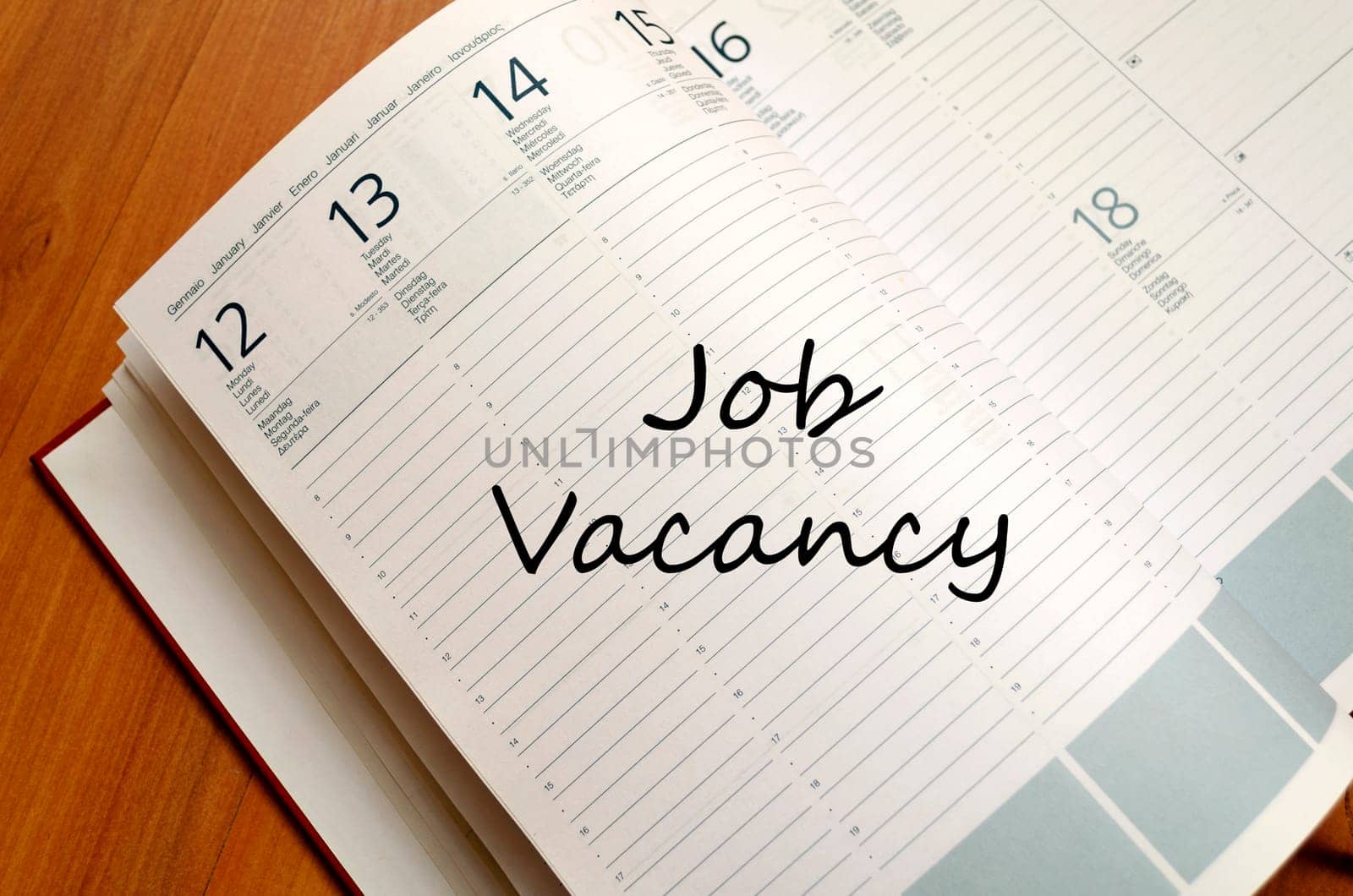 Job vacancy text concept write on notebook with pen