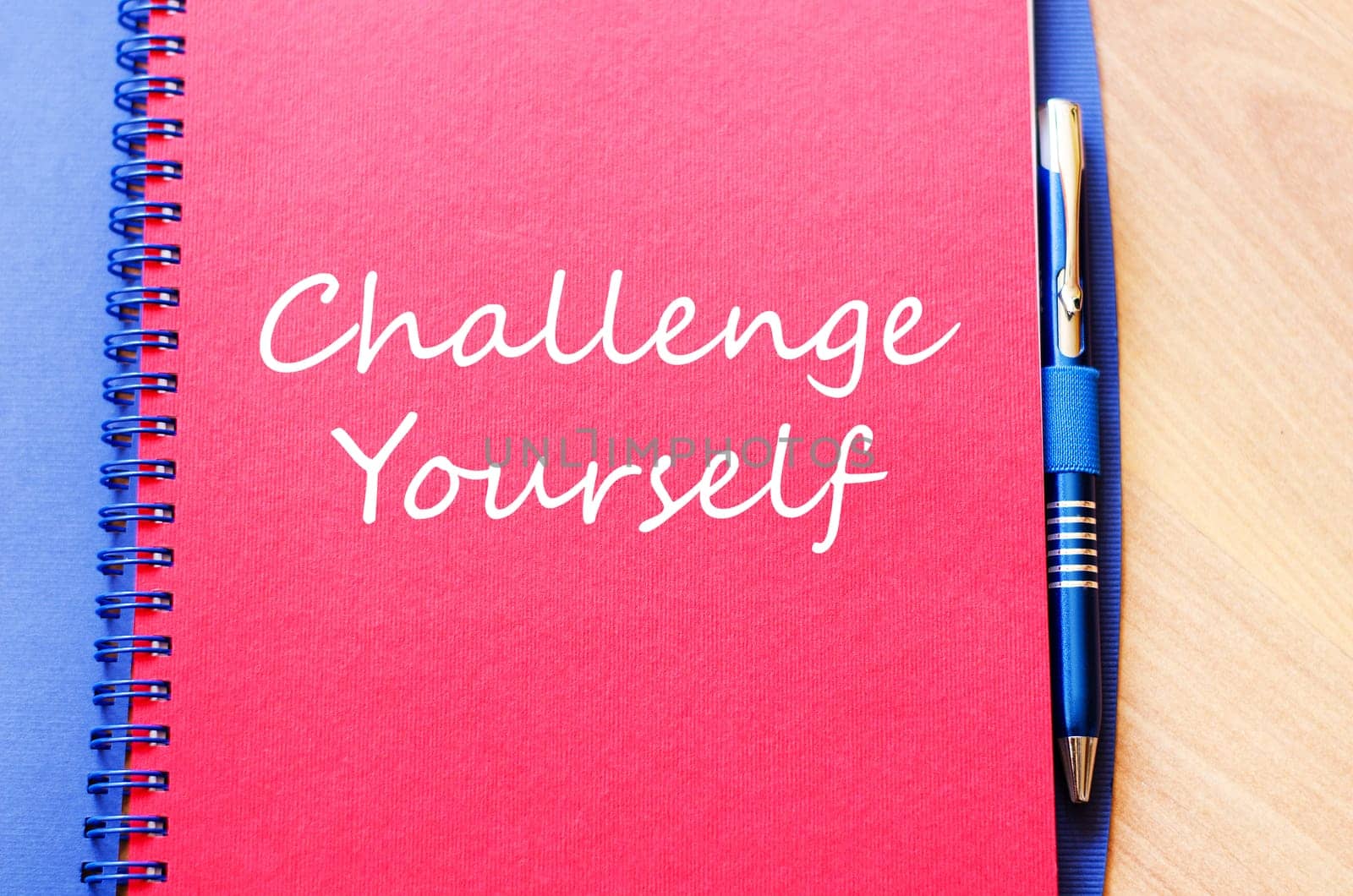 Challenge yourself text concept write on notebook with pen