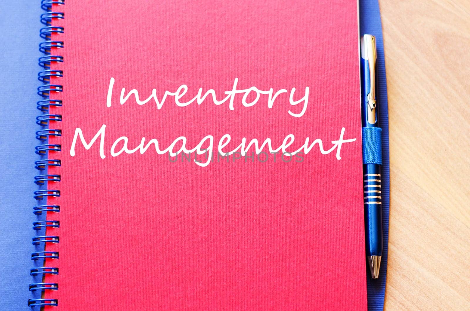 Inventory management text concept write on notebook with pen