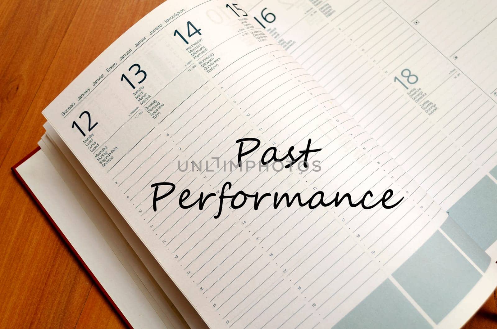 Past performance text concept write on notebook with pen