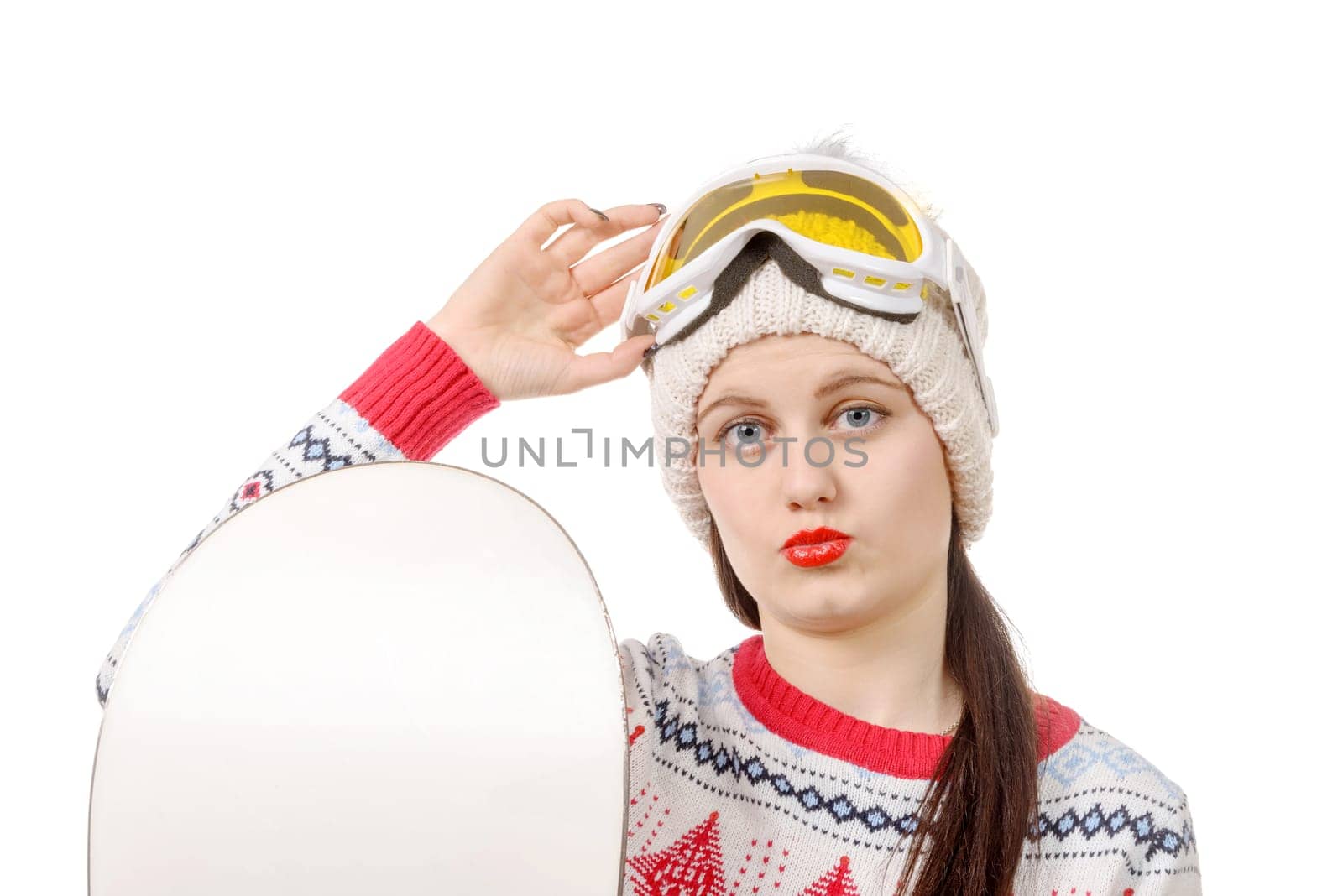 a beautiful woman with a snowboard in studio