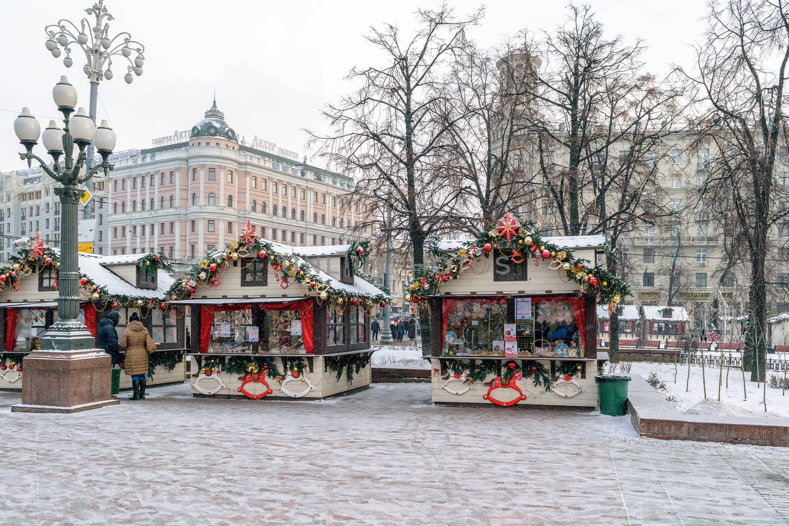 Moscow, Russia - January 05, 2016: Elegant houses with Christmas decorations on a snowy winter street