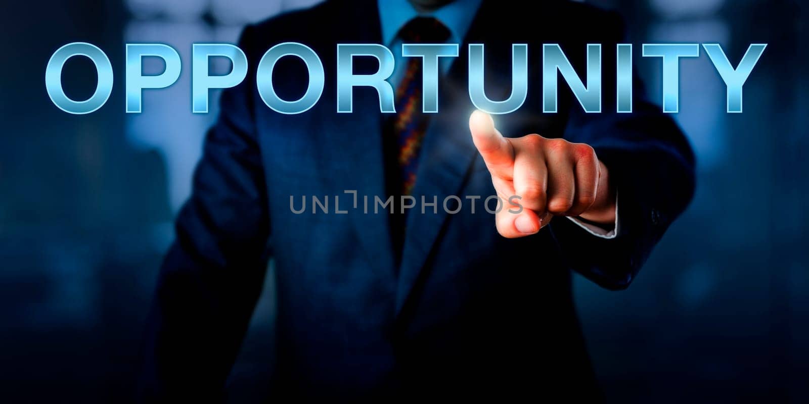 Male entrepreneur pressing OPPORTUNITY on a touch screen interface. Business concept for a market, career or business opportunity. Plenty of copy space across dark suit and blurred office interior.
