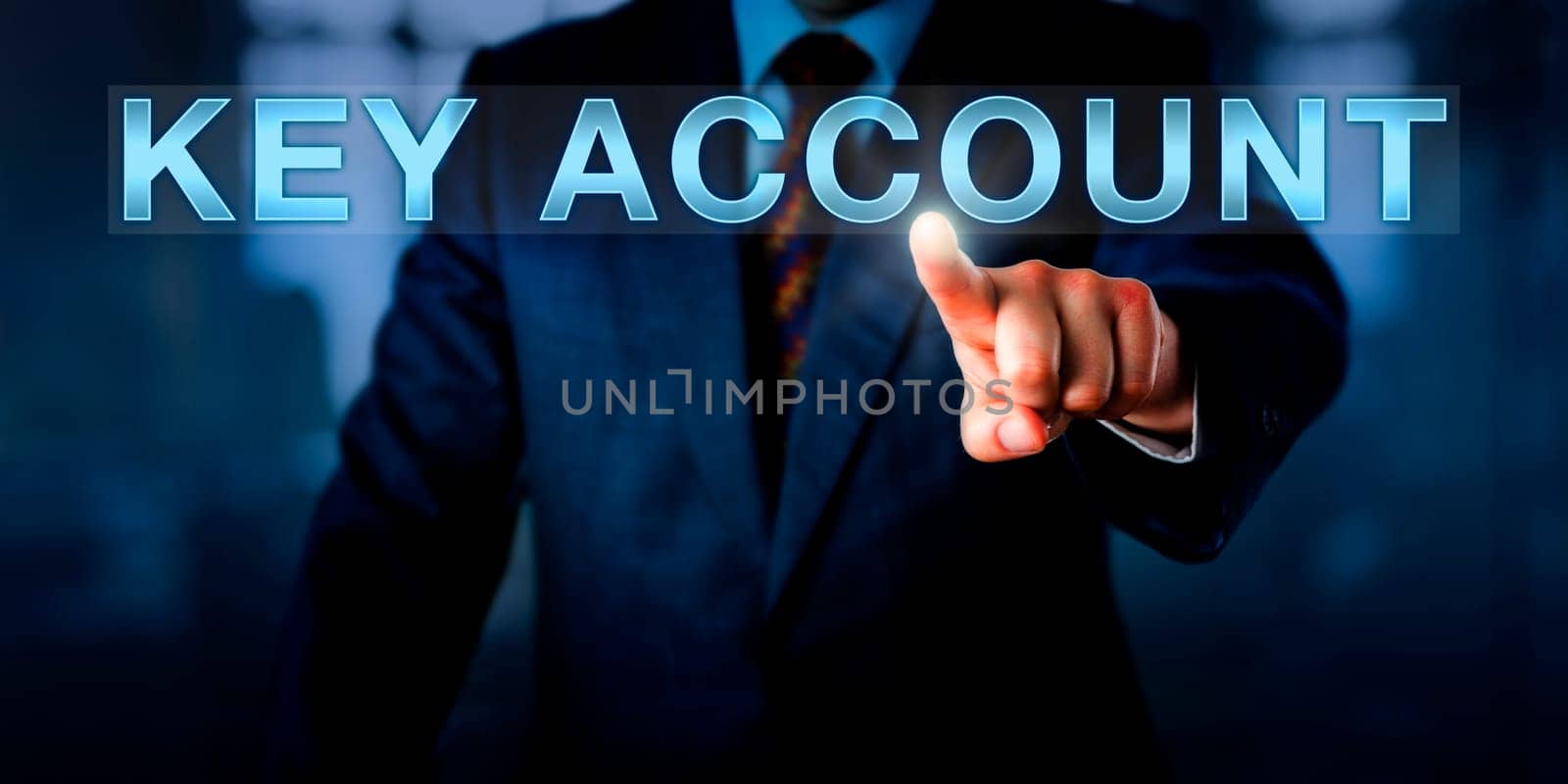 Sales manager is pushing KEY ACCOUNT on a touch screen. Business metaphor and concept for customer relationships with the most profitable clients that account for the majority of company revenue.
