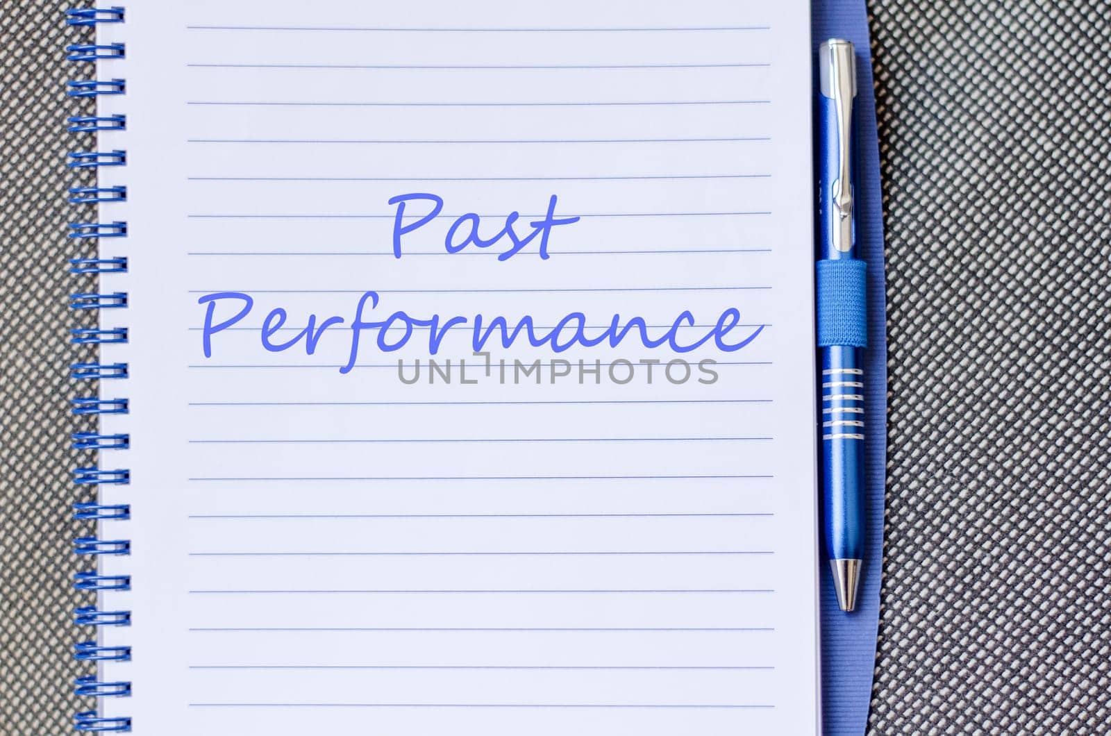 Past performance text concept write on notebook with pen