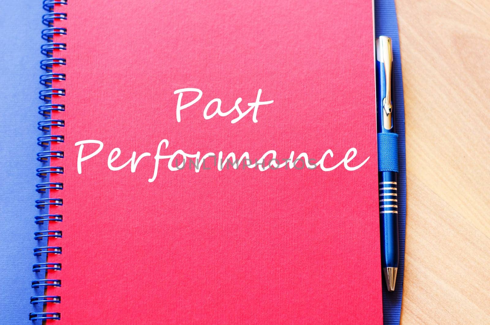 Past performance text concept write on notebook with pen