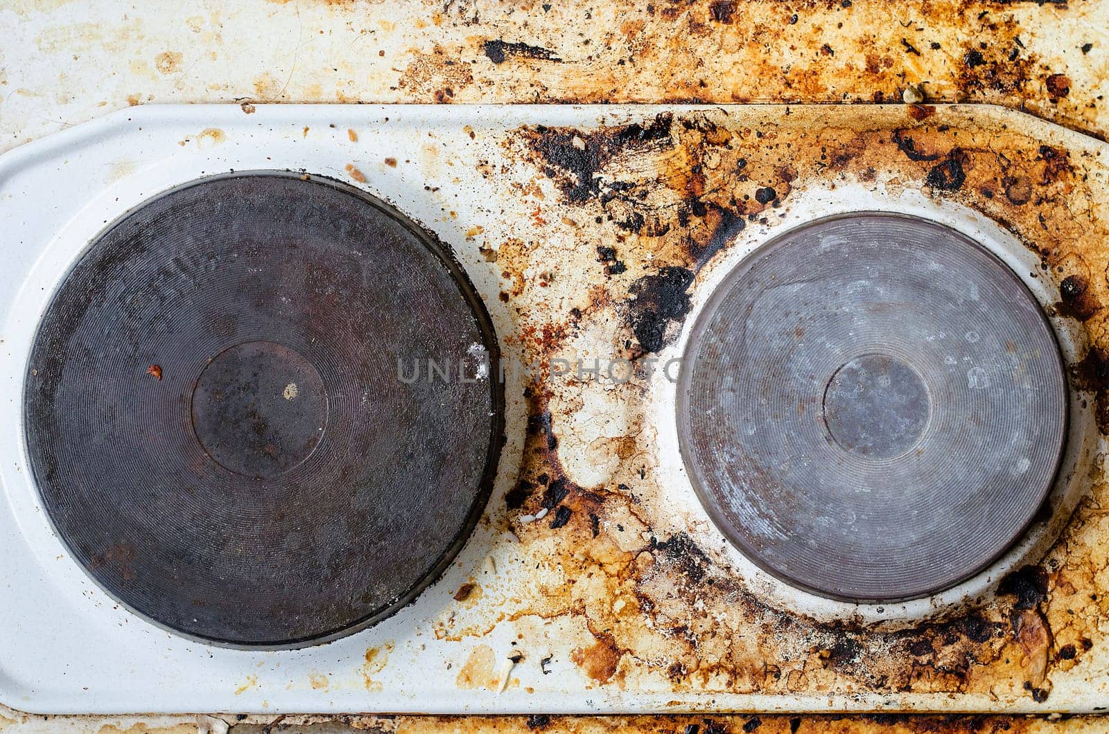 Very dirty hot plate in the kitchen