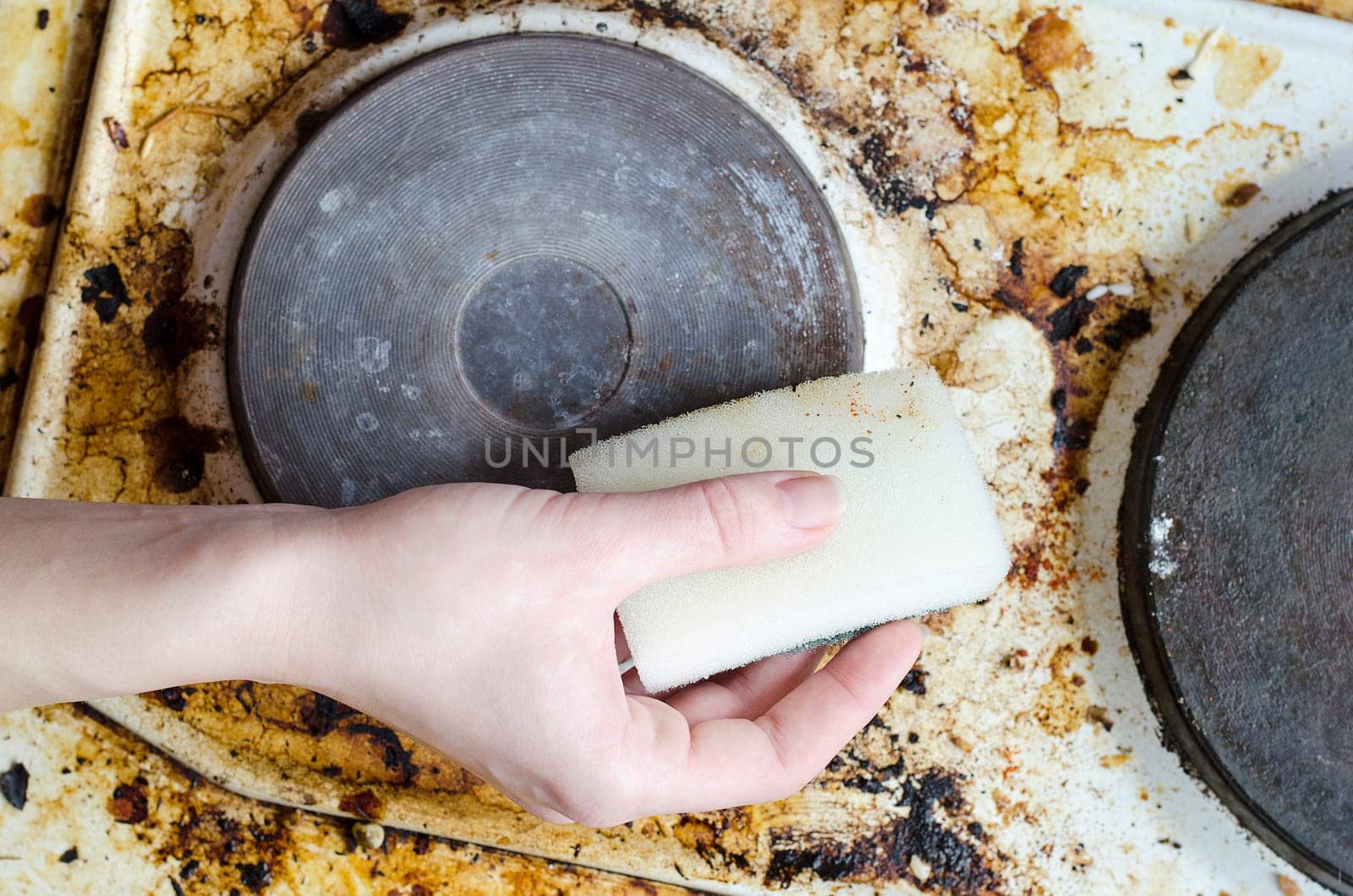 Women hand clean dirty stove