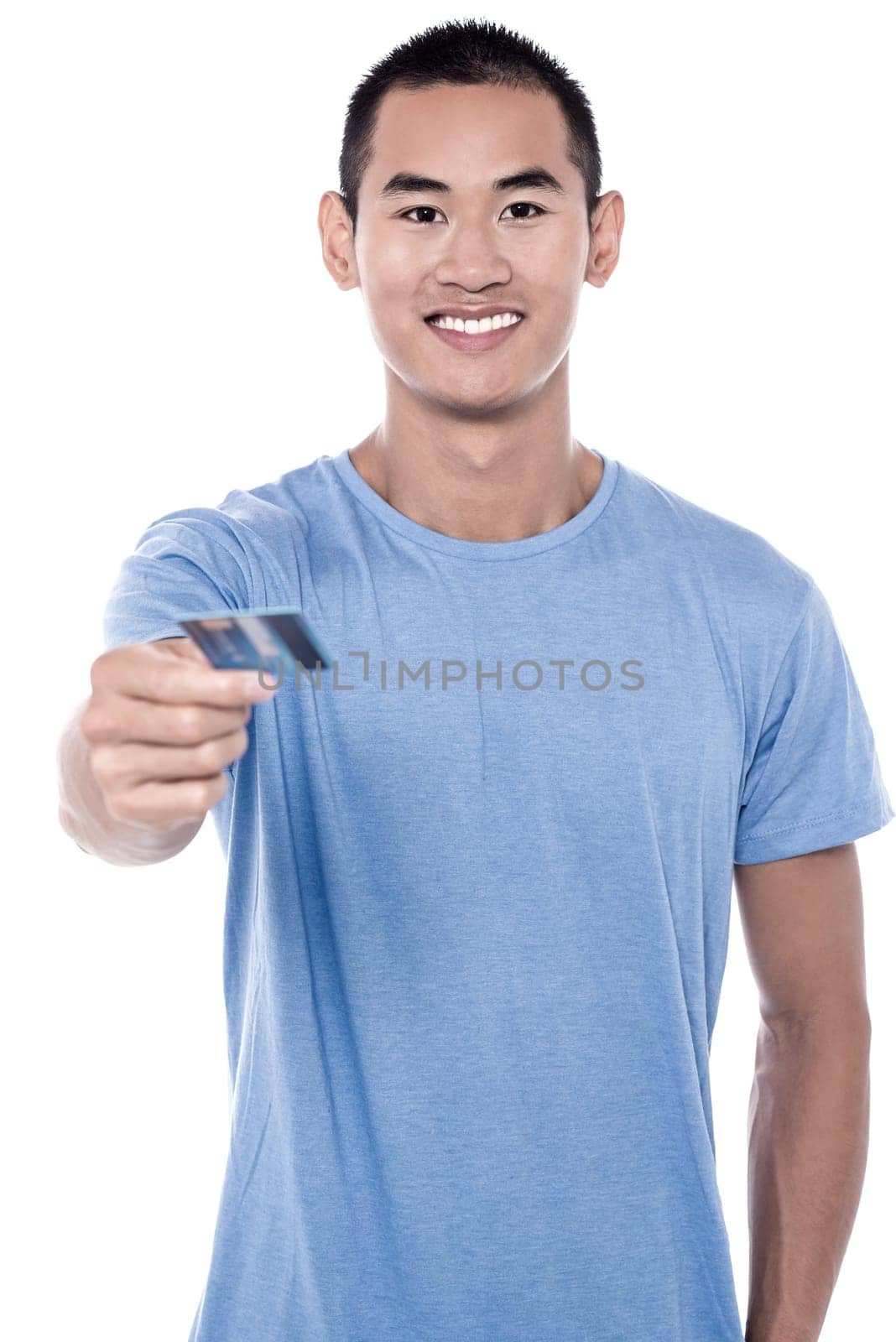 Smiling young man handing over his debit card