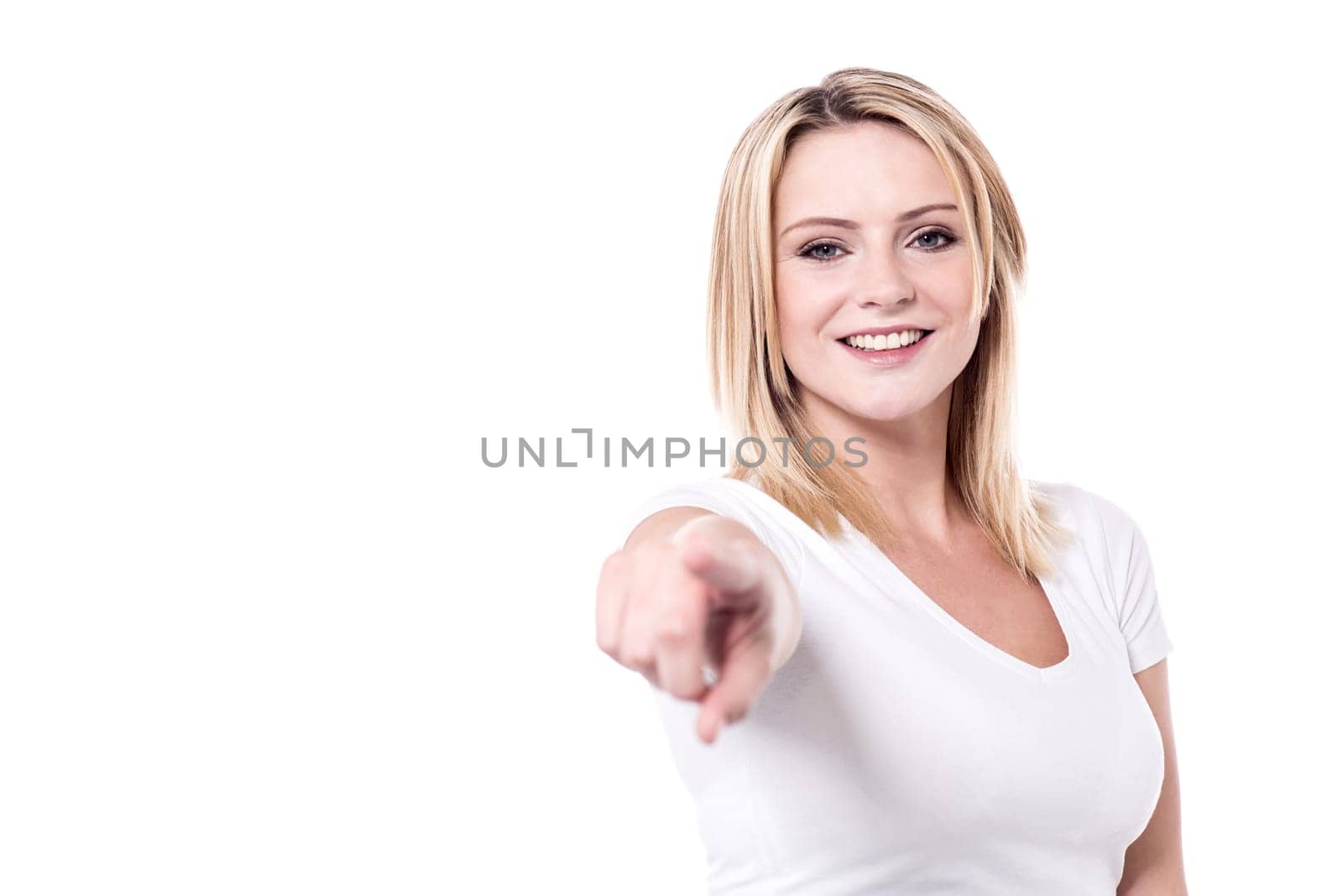 Pretty woman pointing index finger towards camera