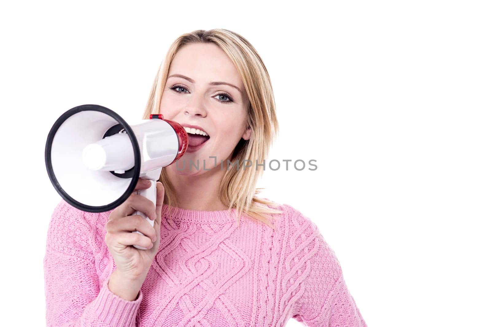 Pretty young woman making announcement with loudhailer