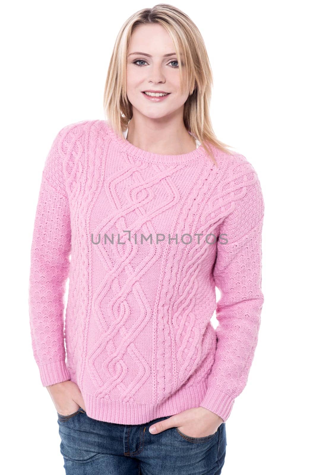 Woman in knitwear posing with hands in pockets