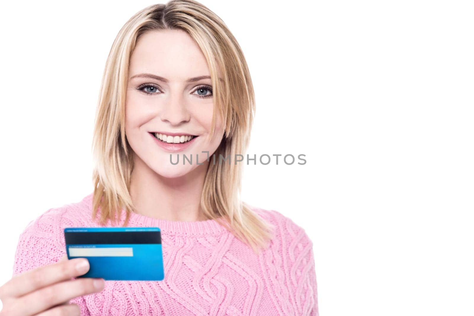 Pretty woman with knitted wear showing debit card