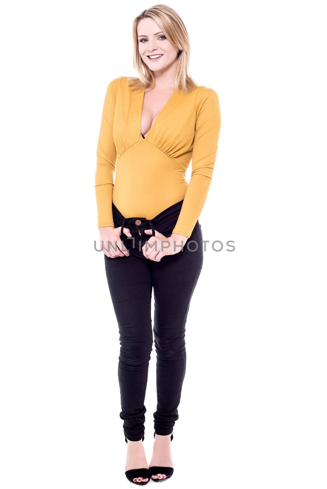 Trendy young woman standing on white background