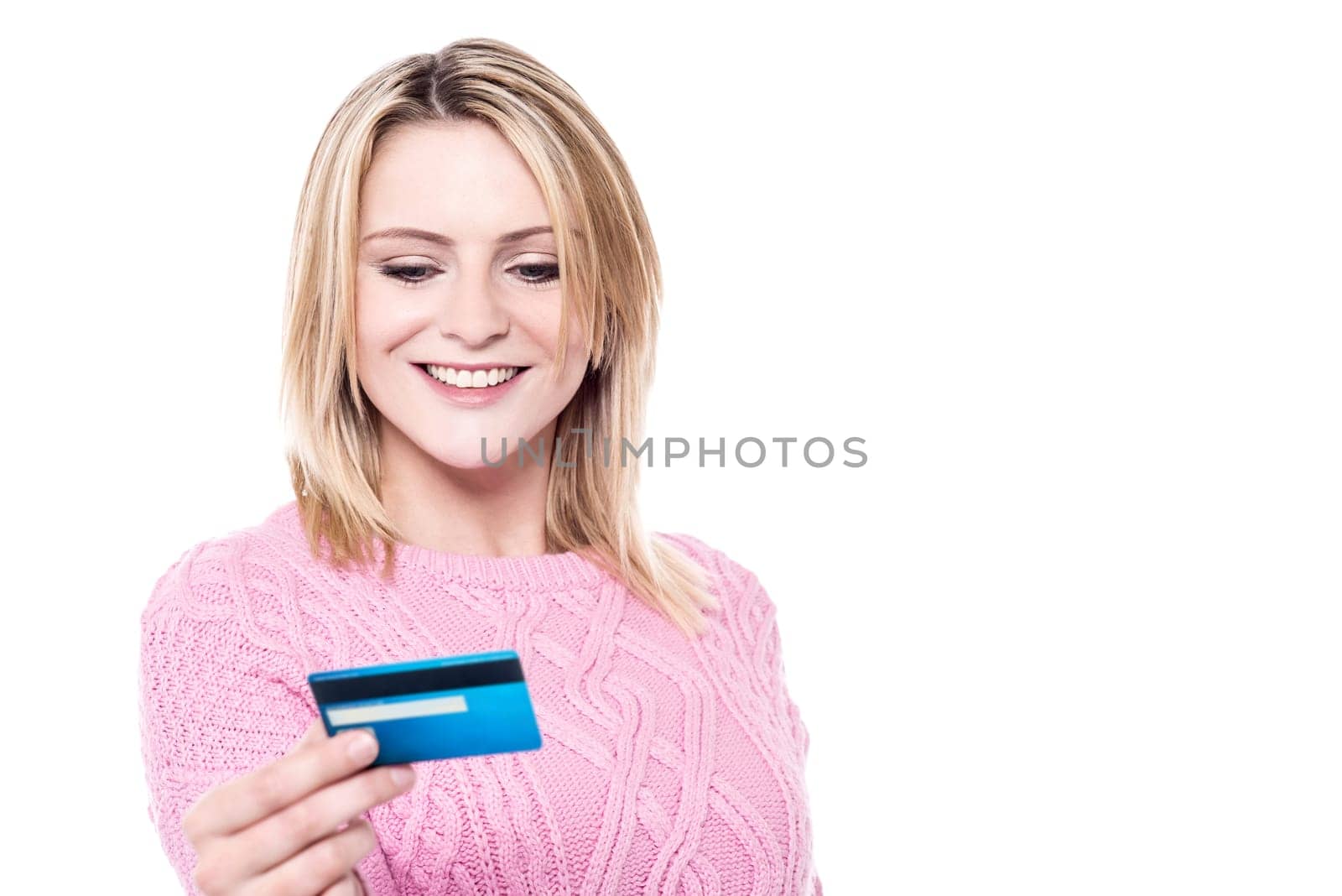 Young woman looking her cash card over white