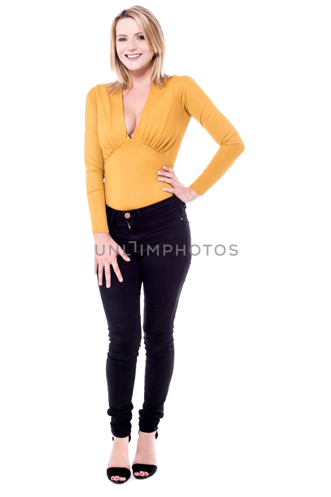 Young woman touching her arm over white