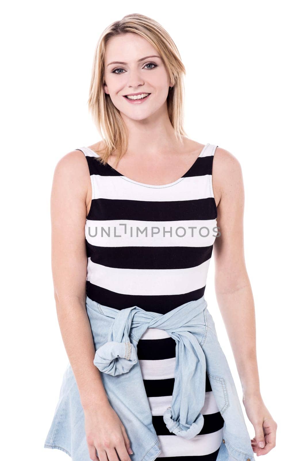 Young woman posing to camera in trendy outfit