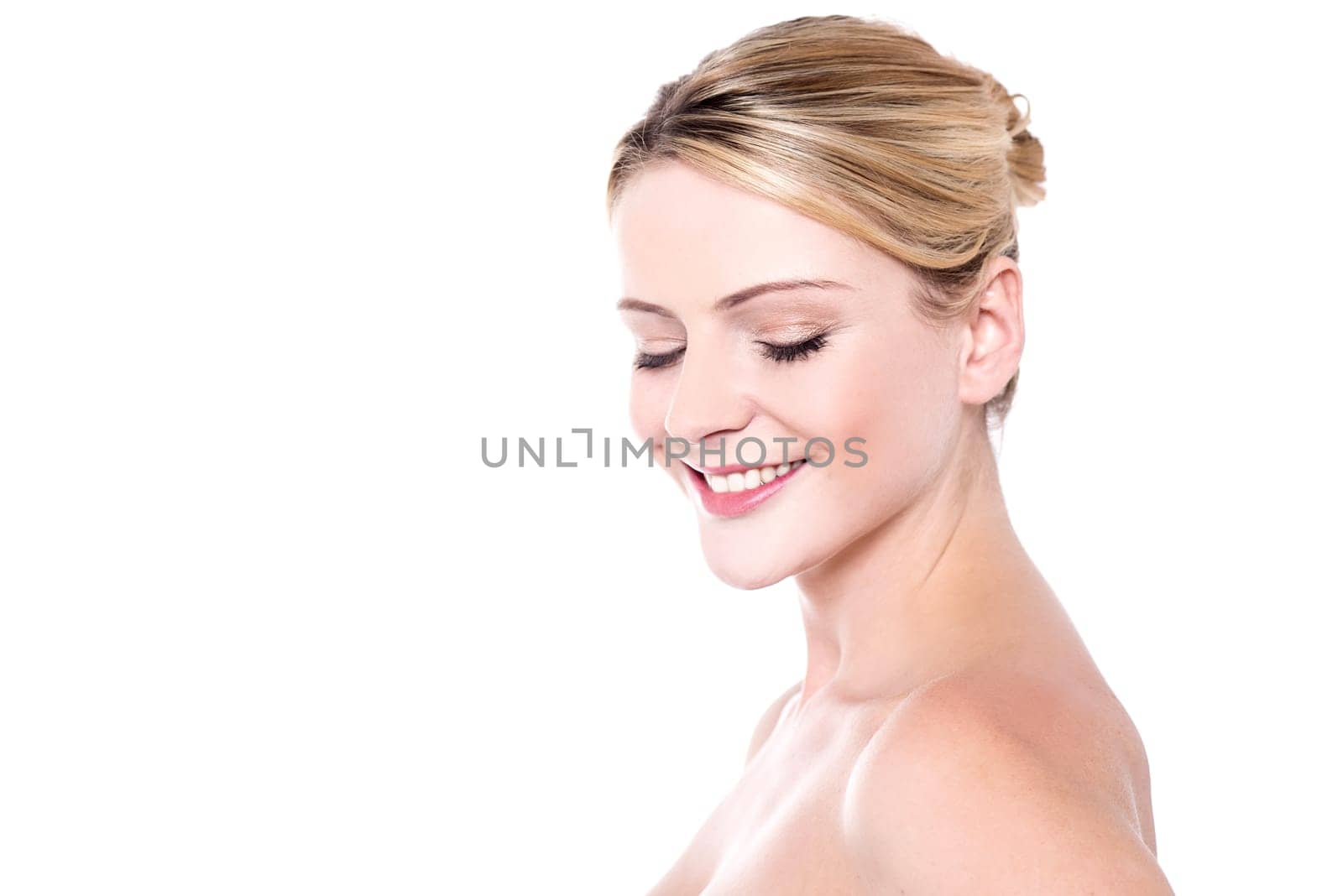 Portrait of young woman with bare shoulders