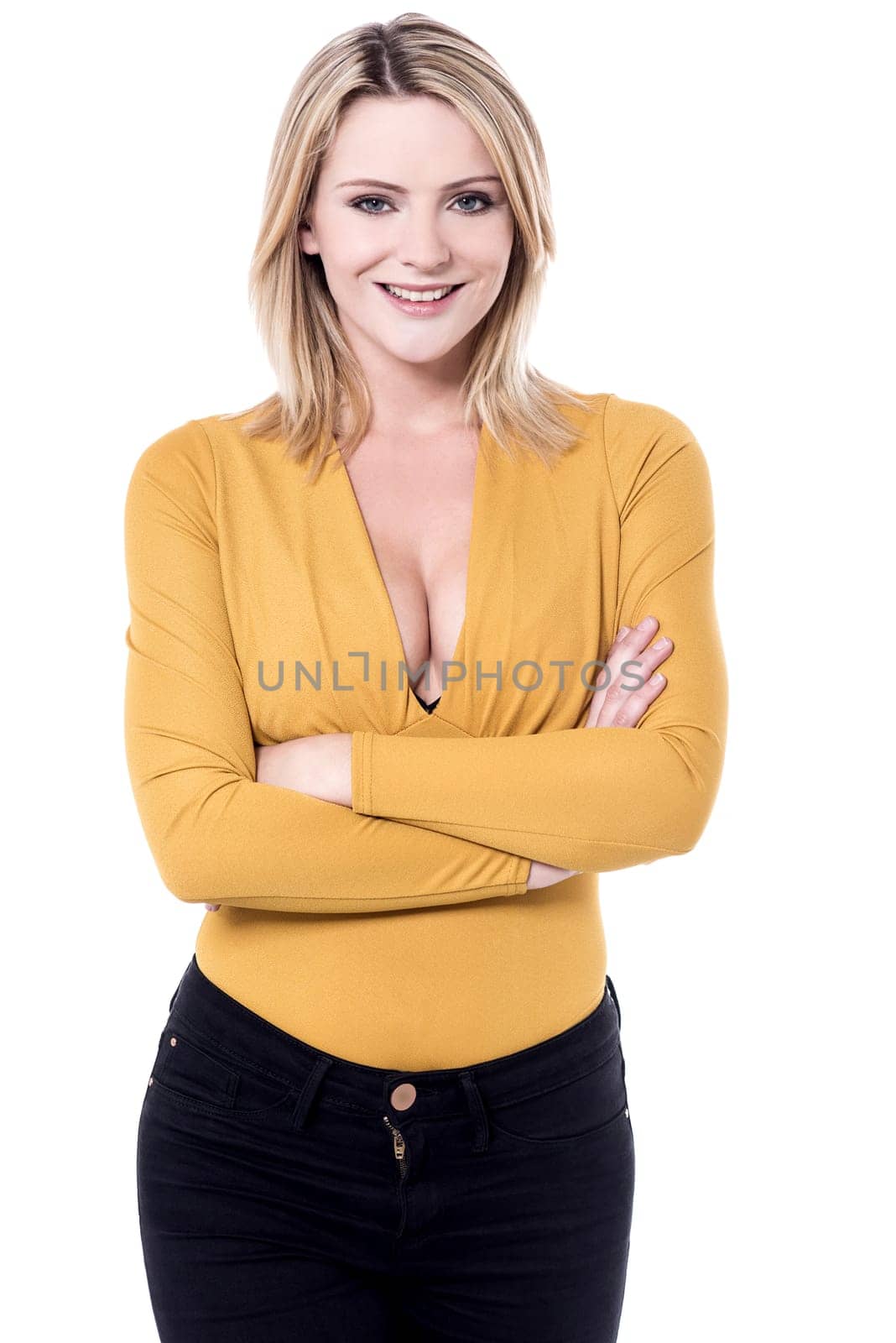 Young woman in party wear with folded arms