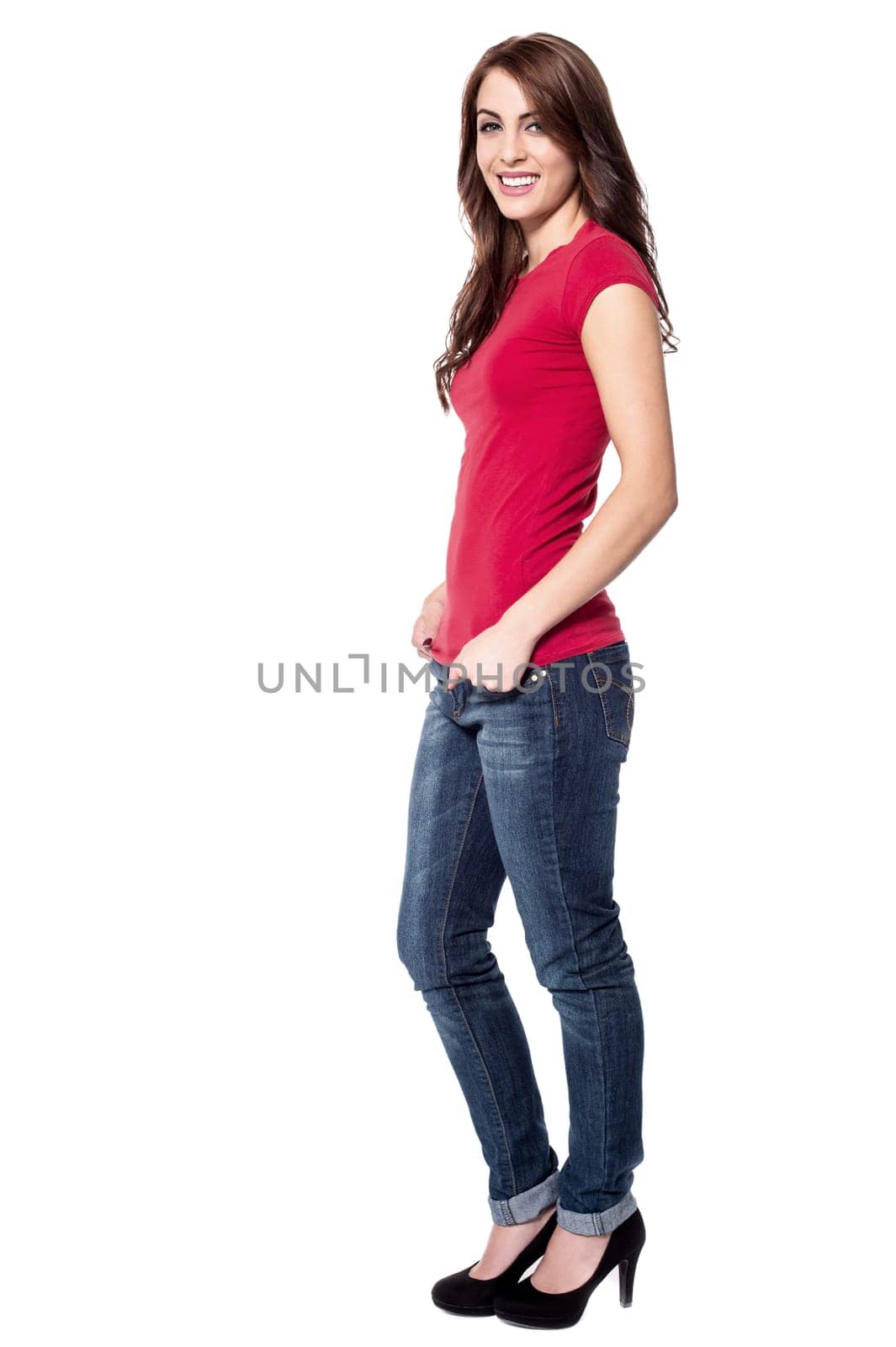 Attractive woman posing with hands in pockets