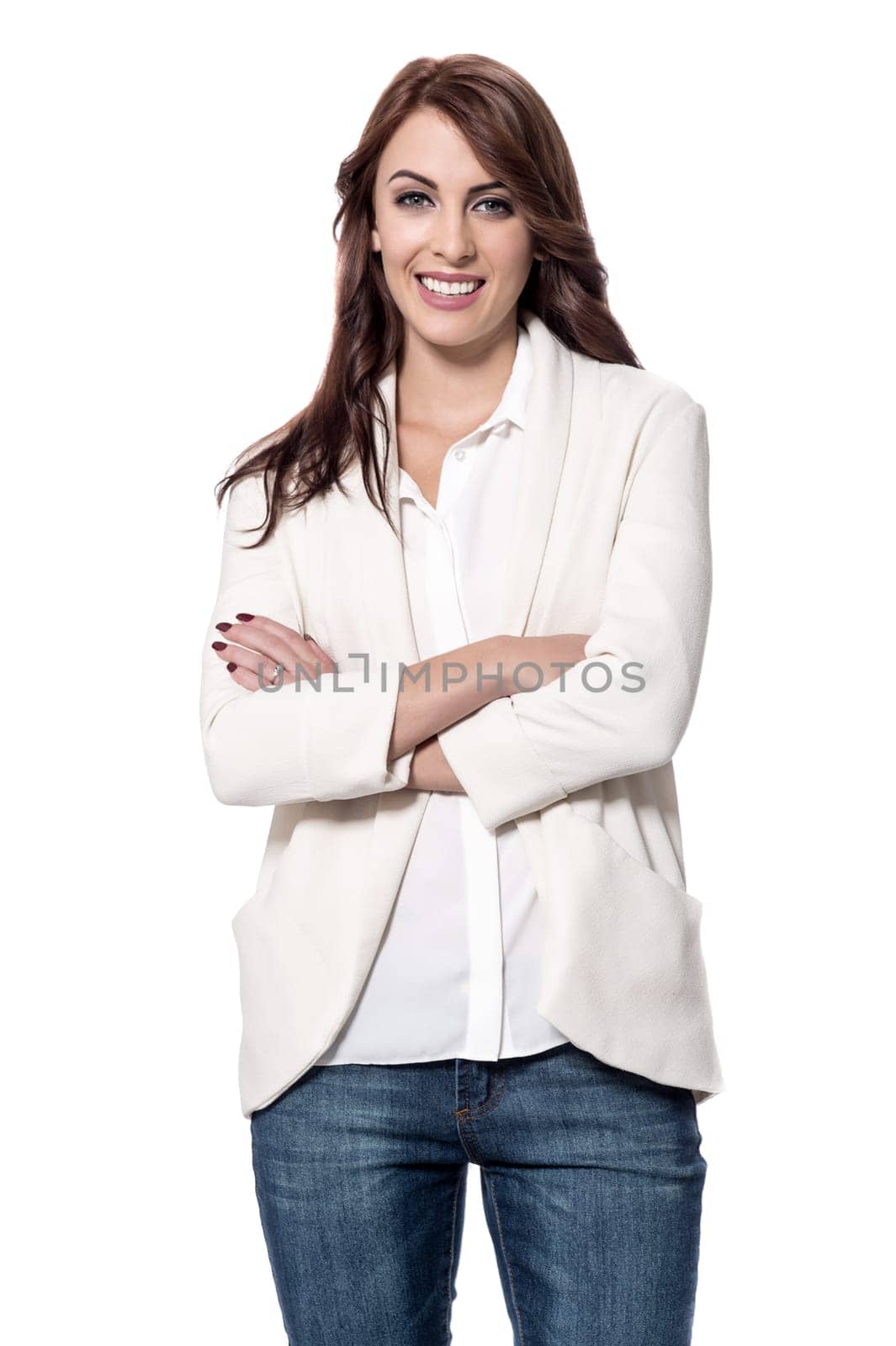 Confident young woman posing with folded arms