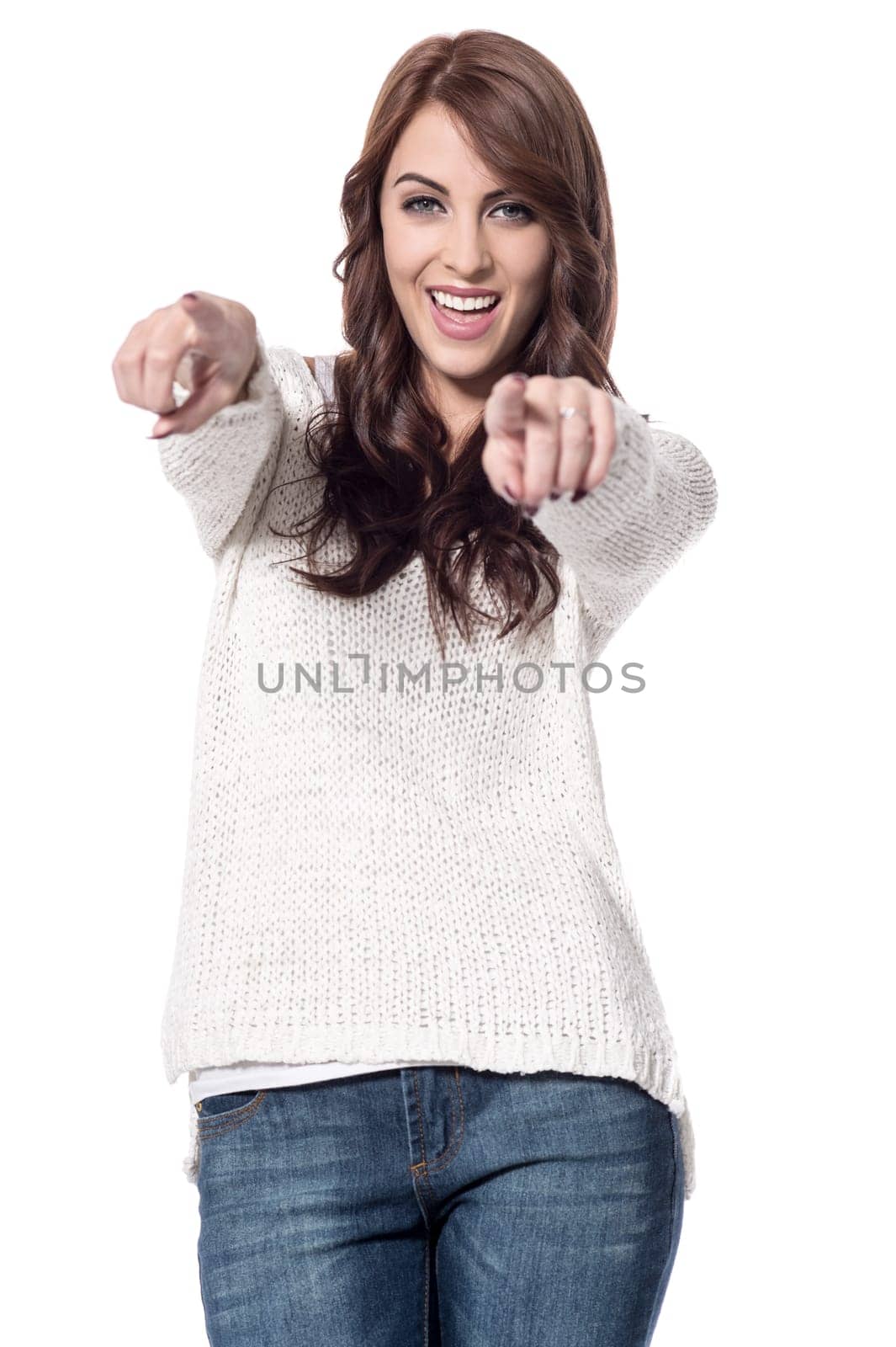 Cheerful young woman pointing fingers towards camera