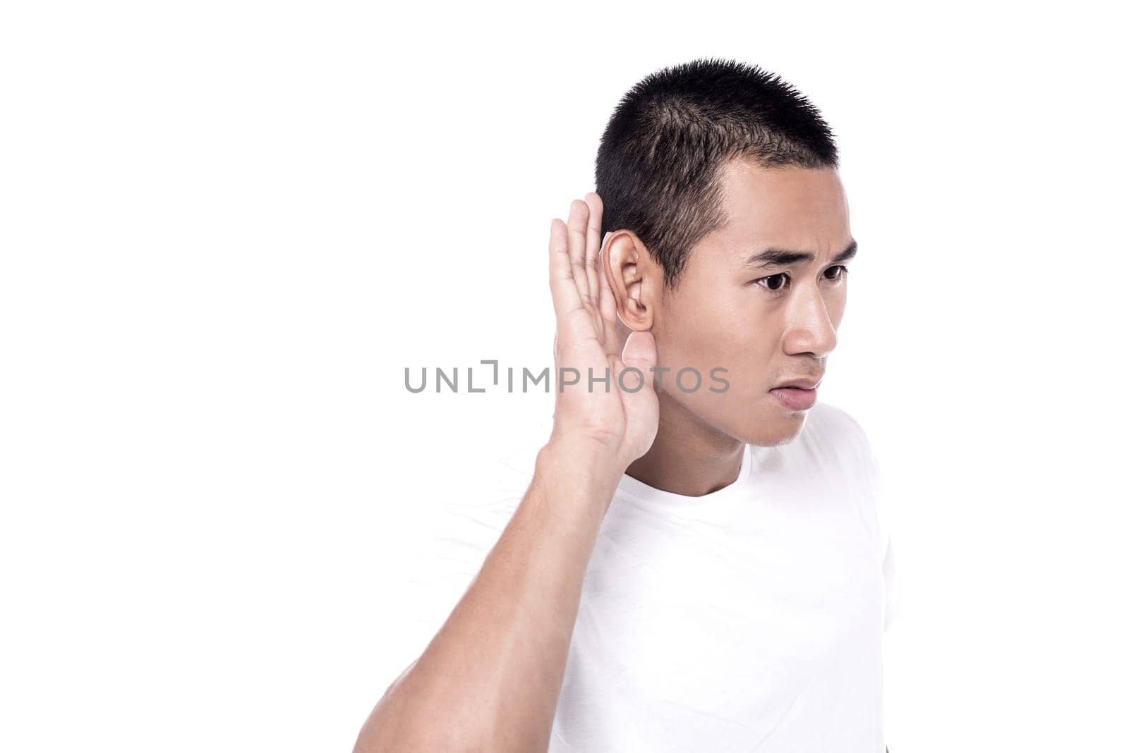 Portrait of handsome man listening into something curiously