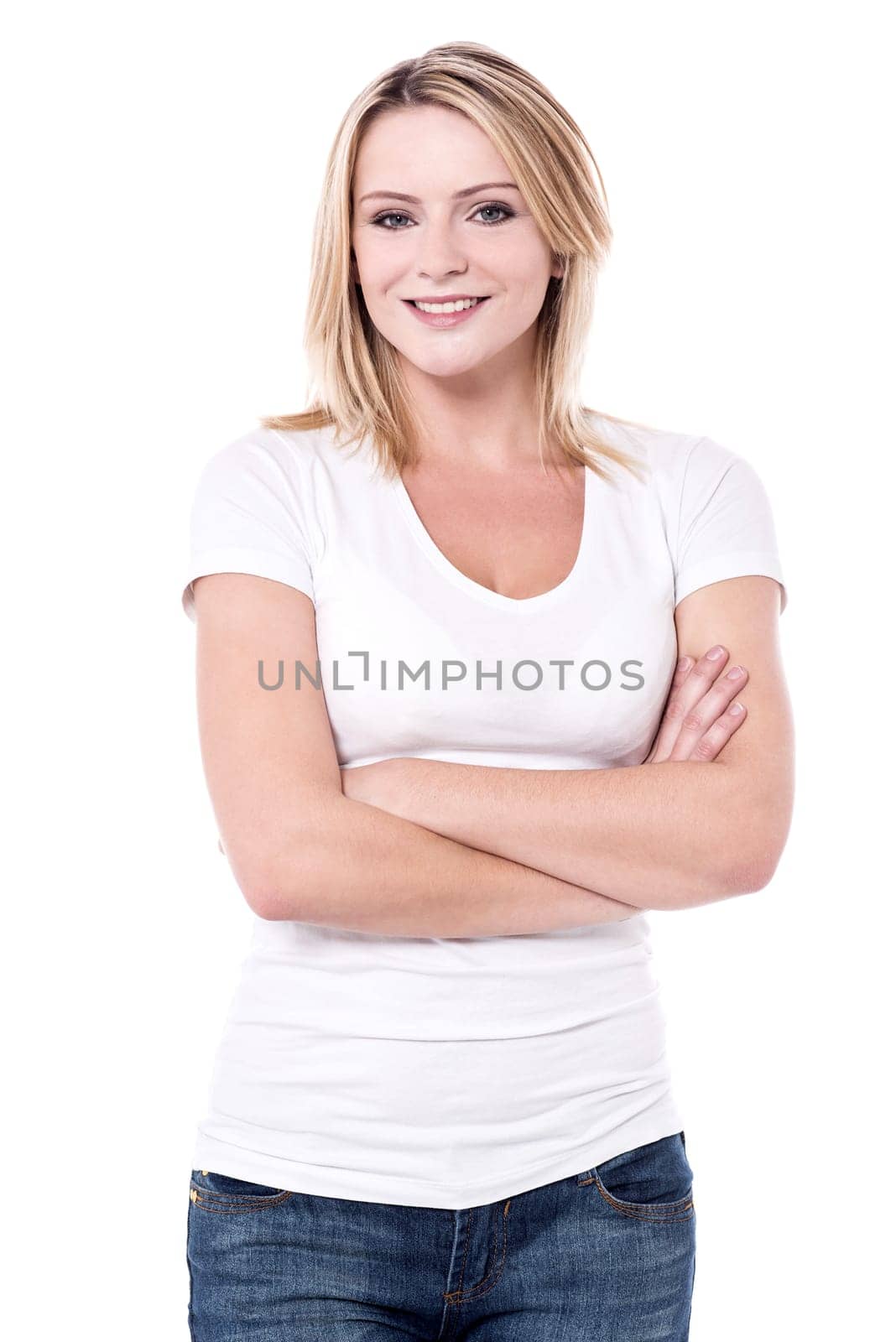 Attractive young woman posing with folded arms