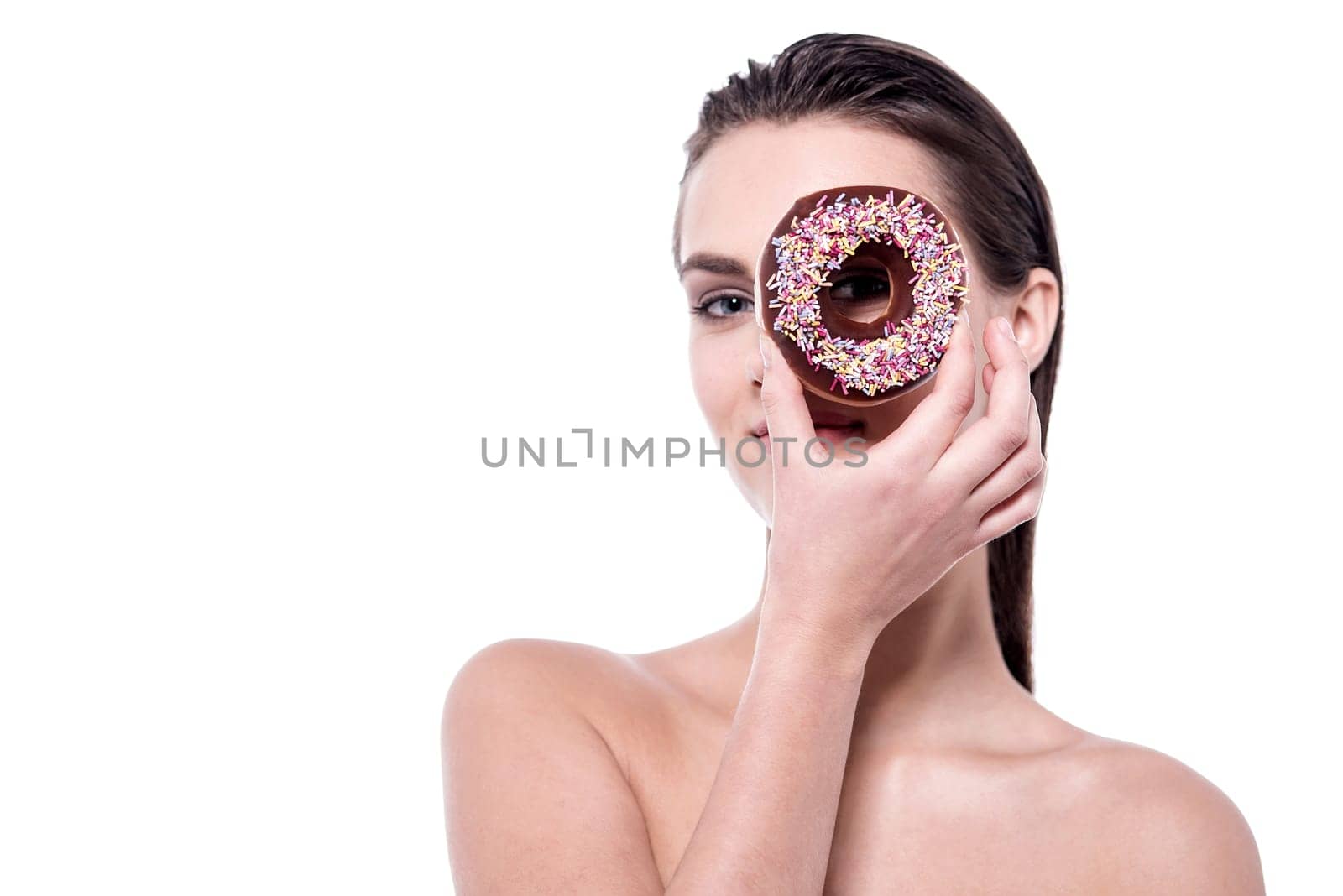 Topless woman focusing through the donut